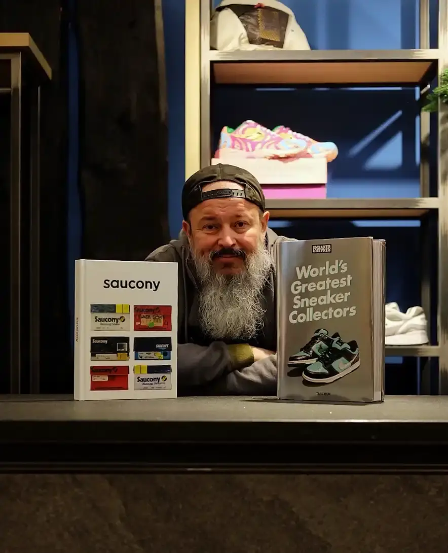 image of Sergey Vetrov, a dedicated Saucony sneaker collector with over 800 pairs. It traces his journey from first discovering the brand in the late '80s to becoming a guardian of its heritage. The piece explores how his collection represents more than footwear—it embodies personal history, community connections, and authentic passion in contrast to fleeting trends. Special focus is given to the challenges he's overcome and the significance of the Shadow 6000 "Invictus" collaboration in connecting him with a global community of enthusiasts. (image 3 of 5)