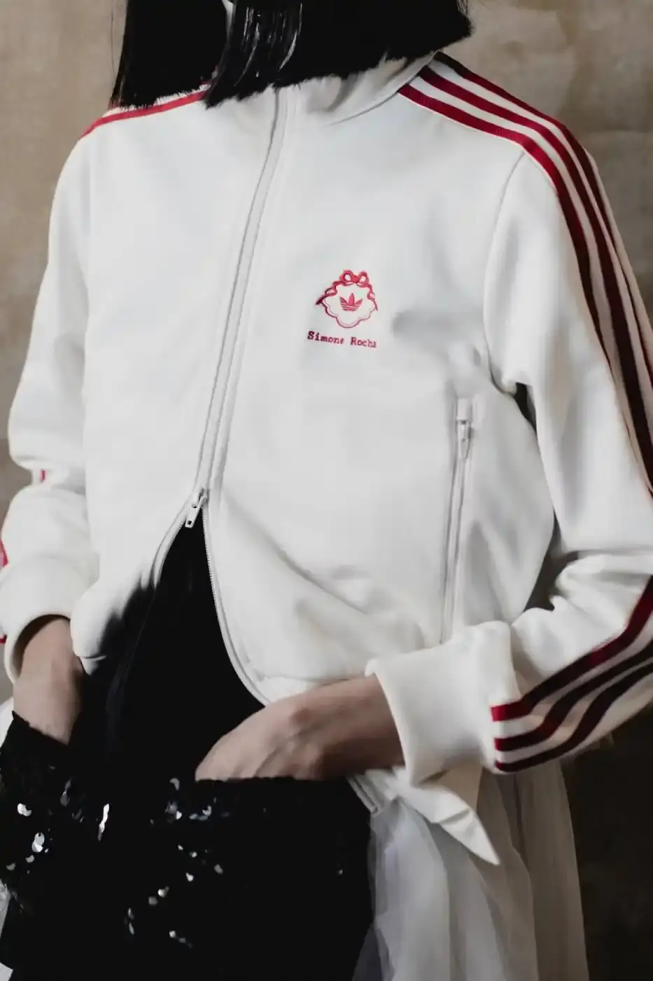 SIMONE ROCHA AND ADIDAS FW26 COLLECTION DETAILS A descriptive report on the design elements and product types included in the Simone Rocha and adidas Fall/Winter 2026 fashion collaboration. (image 7 of 11)