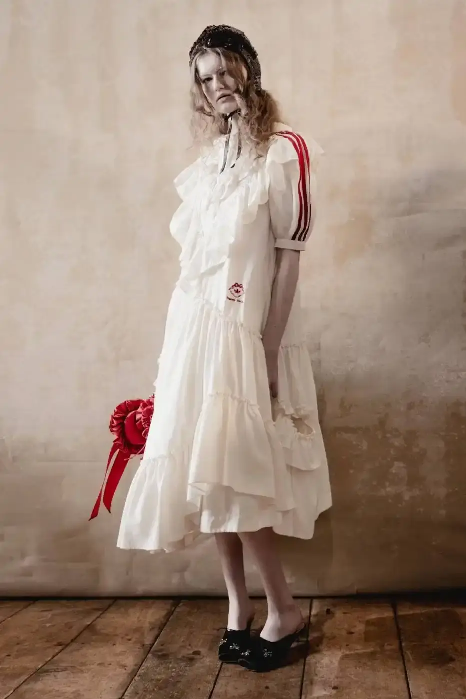 SIMONE ROCHA AND ADIDAS FW26 COLLECTION DETAILS A descriptive report on the design elements and product types included in the Simone Rocha and adidas Fall/Winter 2026 fashion collaboration. (image 9 of 11)