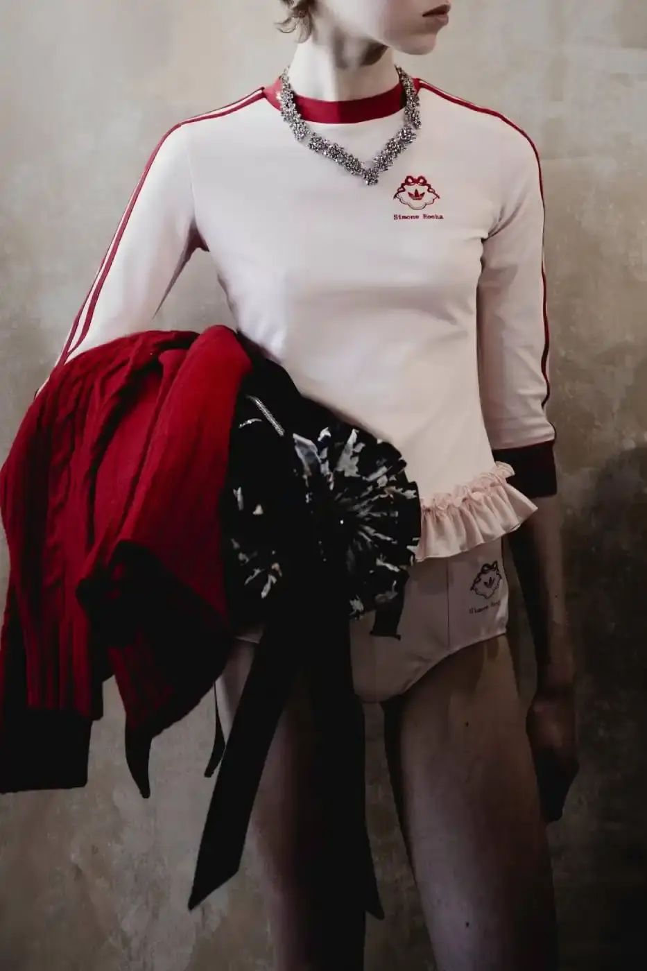 SIMONE ROCHA AND ADIDAS FW26 COLLECTION DETAILS A descriptive report on the design elements and product types included in the Simone Rocha and adidas Fall/Winter 2026 fashion collaboration. (image 10 of 11)