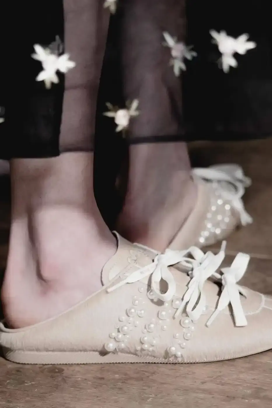 SIMONE ROCHA AND ADIDAS FW26 COLLECTION DETAILS A descriptive report on the design elements and product types included in the Simone Rocha and adidas Fall/Winter 2026 fashion collaboration. (image 11 of 11)