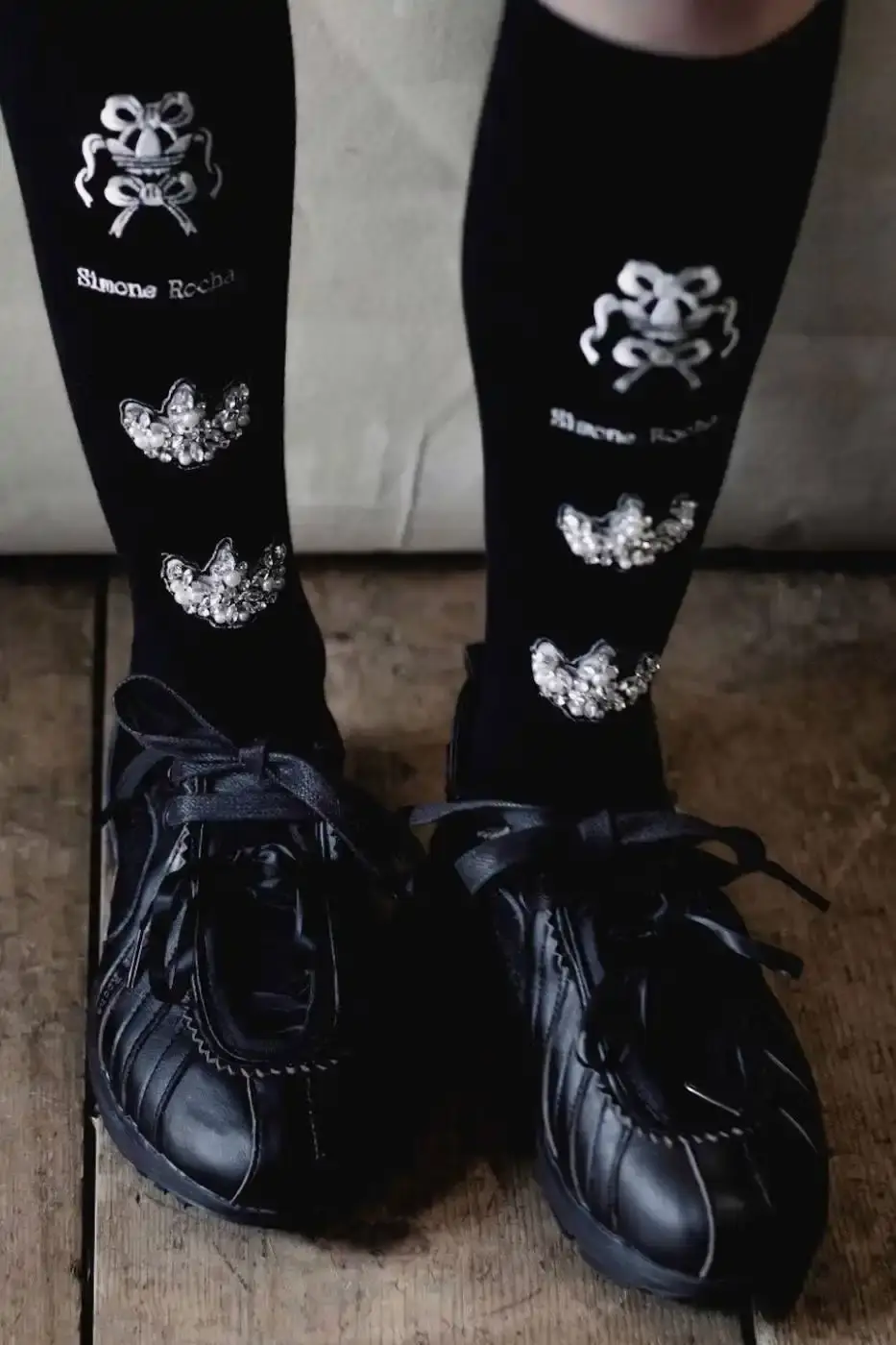 SIMONE ROCHA AND ADIDAS FW26 COLLECTION DETAILS A descriptive report on the design elements and product types included in the Simone Rocha and adidas Fall/Winter 2026 fashion collaboration. (image 5 of 11)