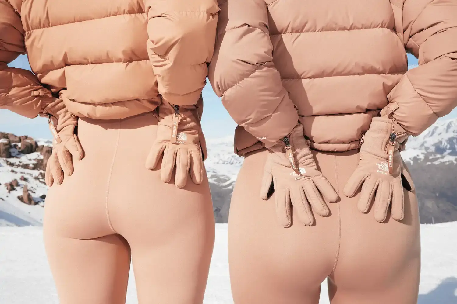 Diverse group of models wearing SKIMS x The North Face collection, standing on dramatic Chilean mountain peaks, showcasing monochromatic layered winter apparel (image 2 of 2)
