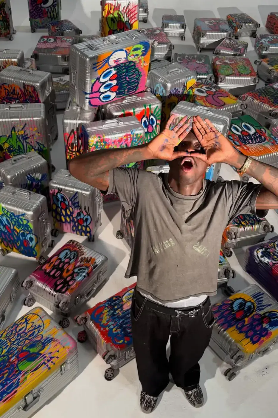 SLAWN TEASES RIMOWA SUITCASE COLLABORATION Image of an article about artist Olaolu Slawn teasing a graffiti-styled luggage collaboration with RIMOWA. (image 2 of 7)