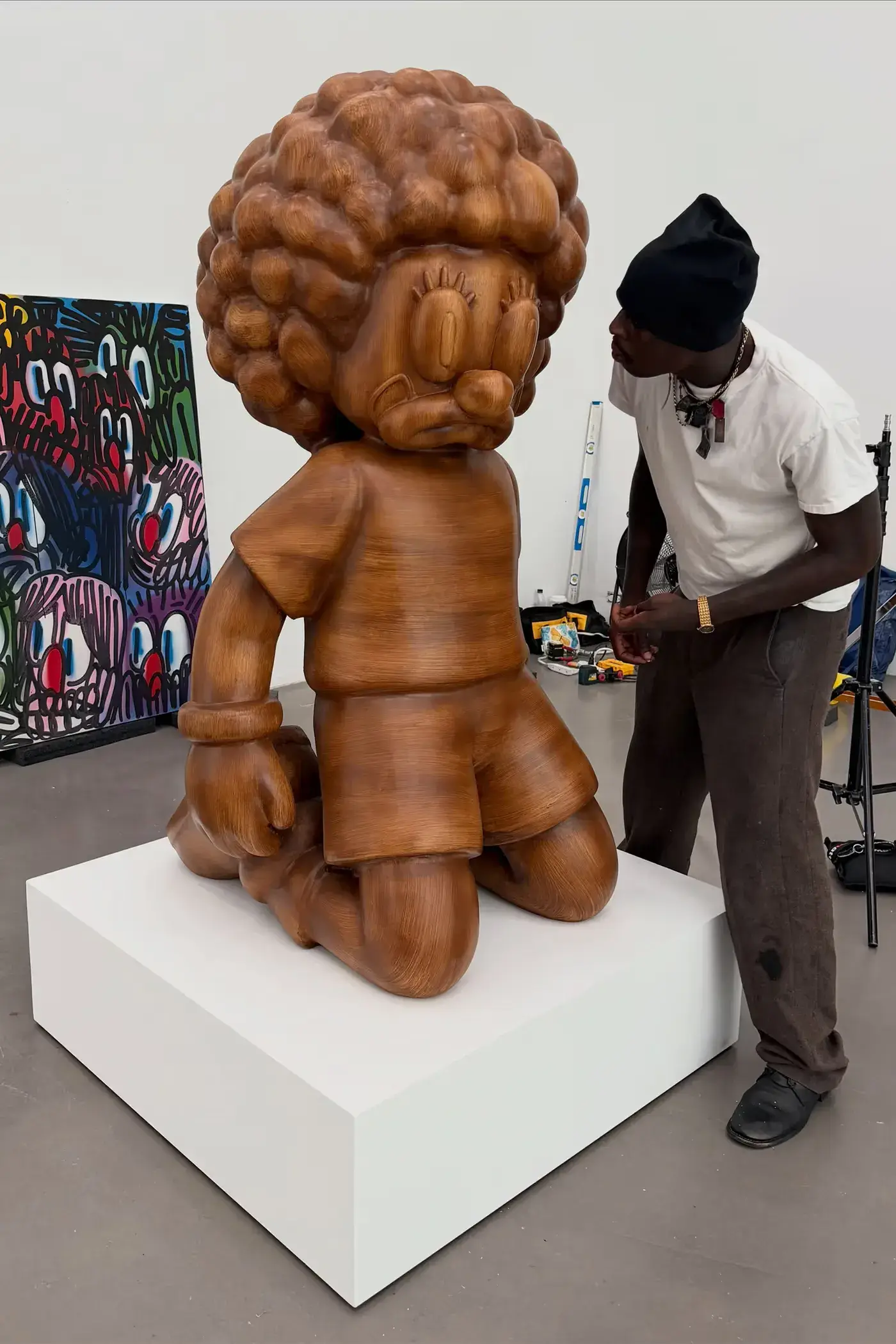 SLAWN EXHIBITION OPENS IN CHELSEA NEW YORK image description detailing London artist Olaolu Slawn's debut New York pop up art exhibition including large scale paintings and sportswear apparel. (image 7 of 14)