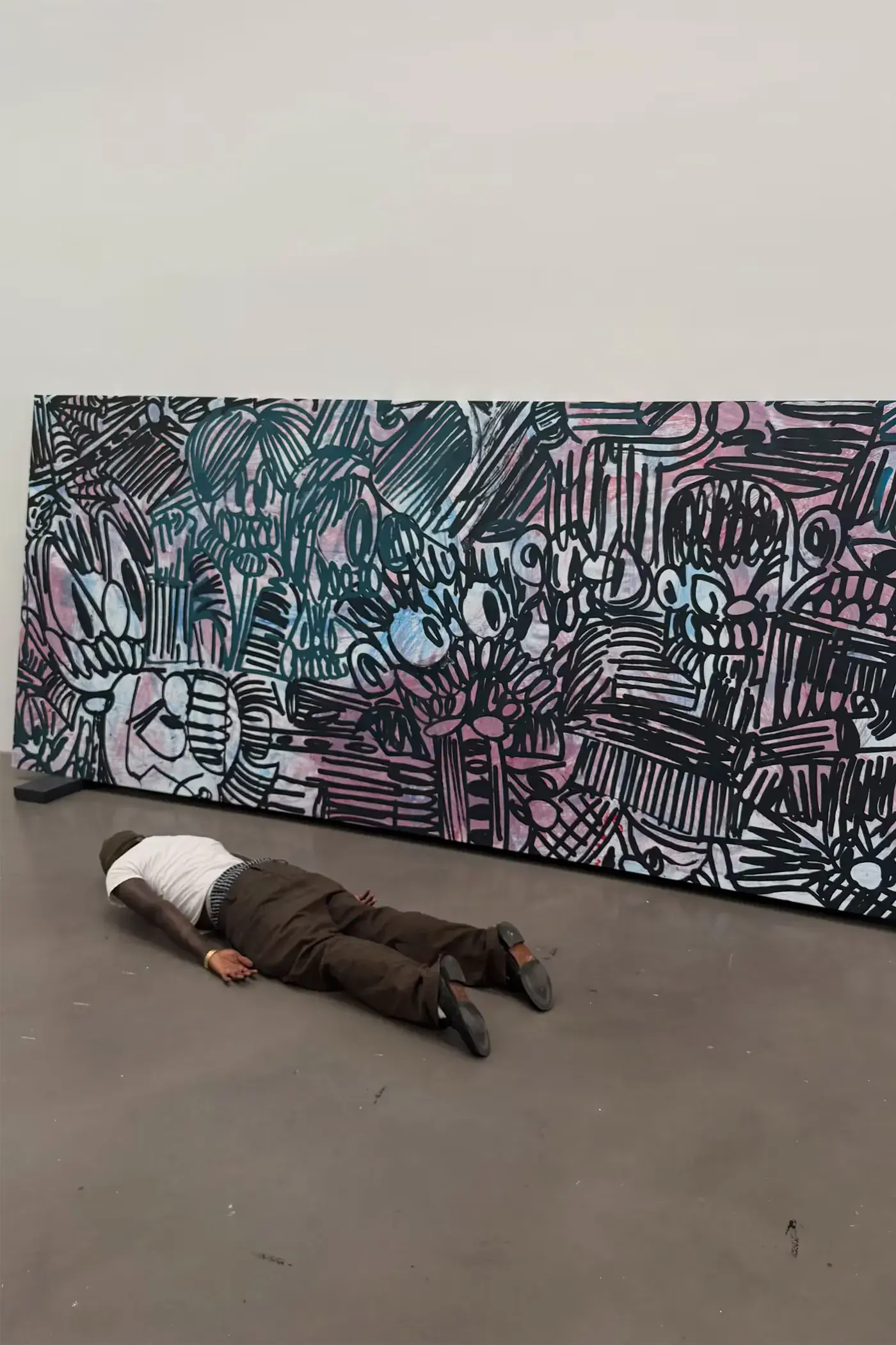 SLAWN EXHIBITION OPENS IN CHELSEA NEW YORK image description detailing London artist Olaolu Slawn's debut New York pop up art exhibition including large scale paintings and sportswear apparel. (image 2 of 14)