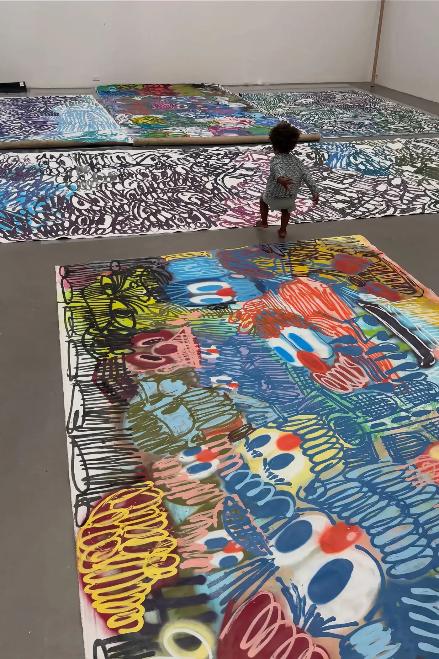 SLAWN EXHIBITION OPENS IN CHELSEA NEW YORK image description detailing London artist Olaolu Slawn's debut New York pop up art exhibition including large scale paintings and sportswear apparel. (image 14 of 14)