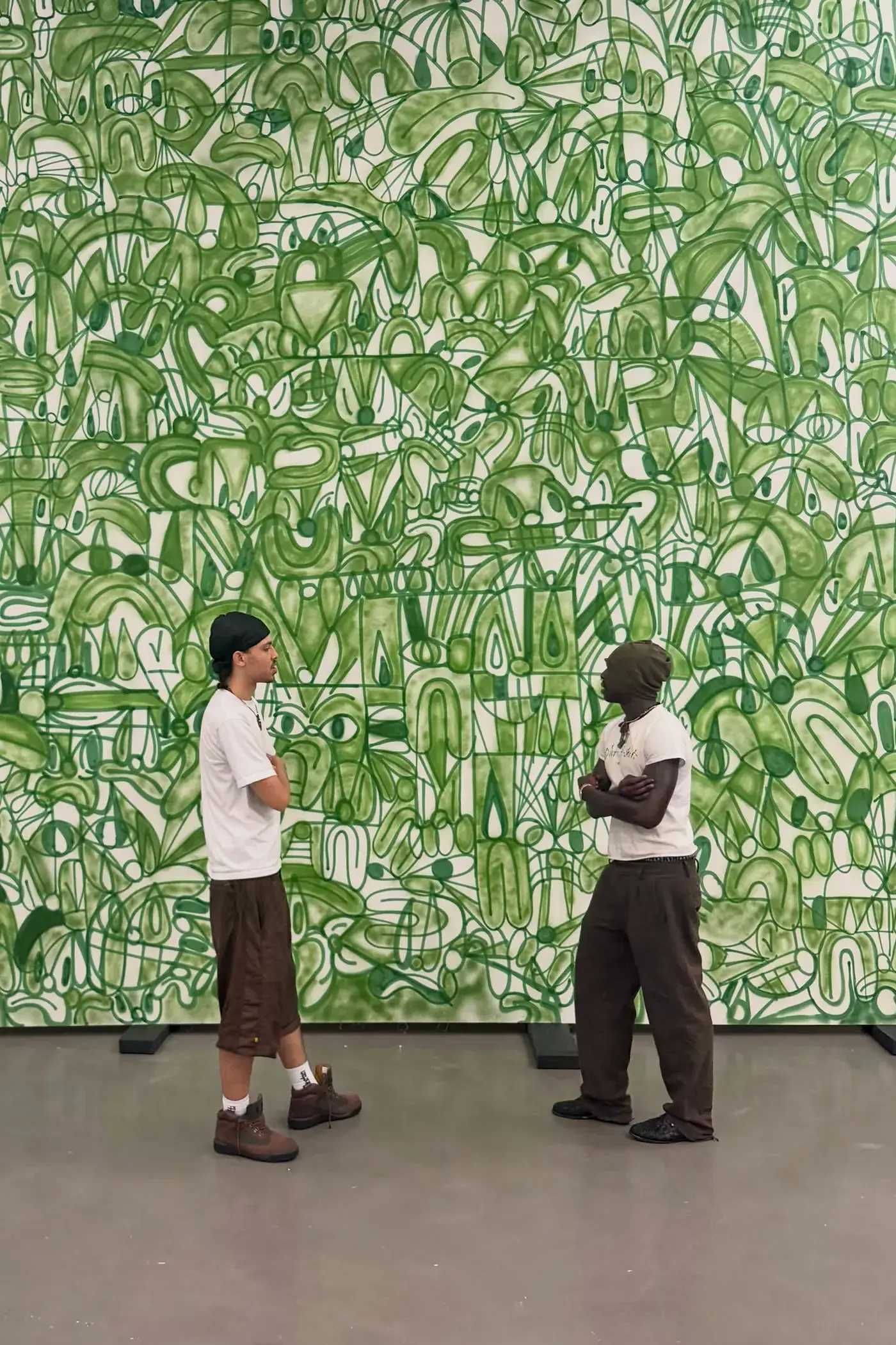 SLAWN EXHIBITION OPENS IN CHELSEA NEW YORK image description detailing London artist Olaolu Slawn's debut New York pop up art exhibition including large scale paintings and sportswear apparel. (image 3 of 14)