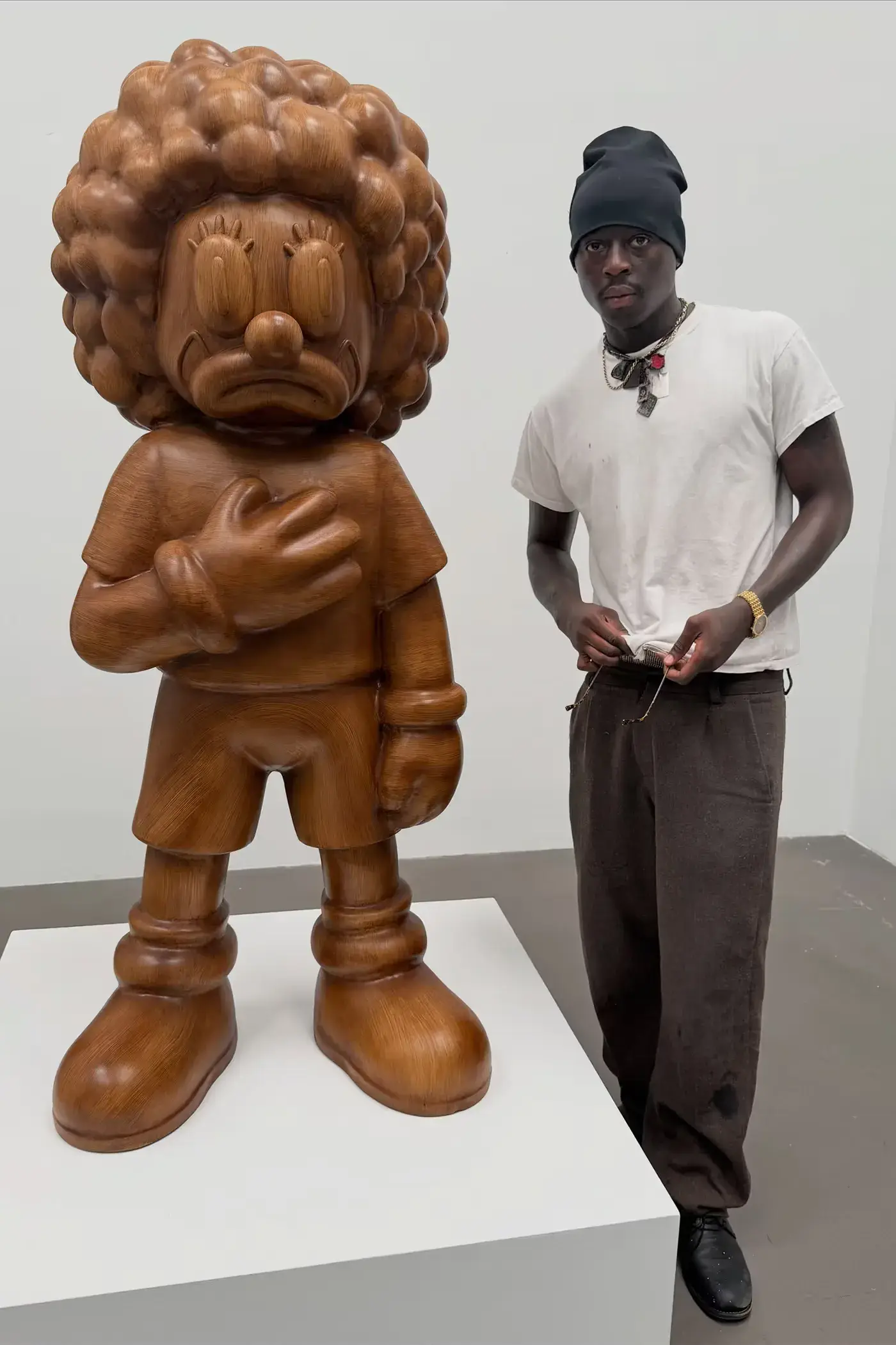 SLAWN EXHIBITION OPENS IN CHELSEA NEW YORK image description detailing London artist Olaolu Slawn's debut New York pop up art exhibition including large scale paintings and sportswear apparel. (image 8 of 14)