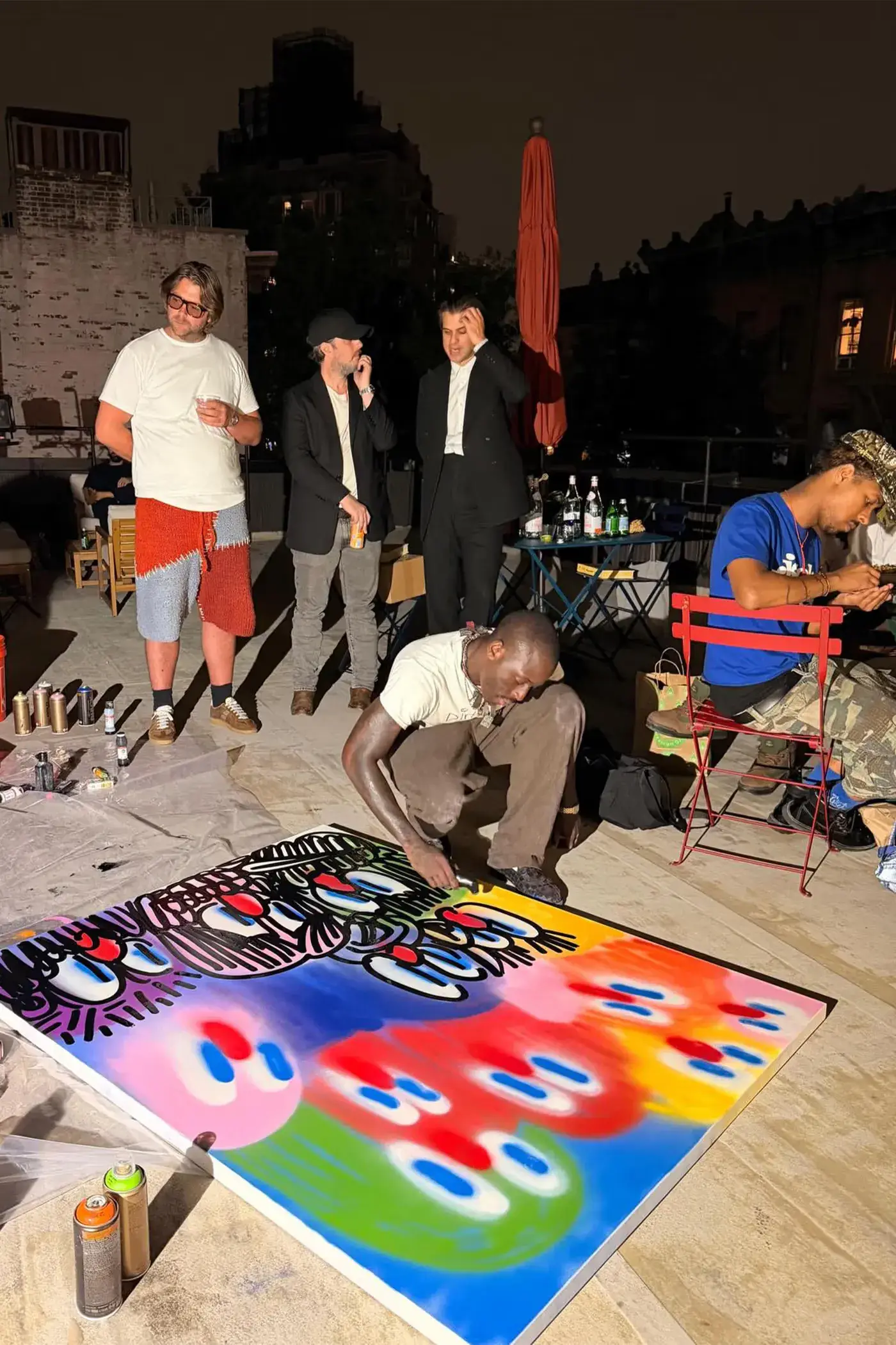 SLAWN EXHIBITION OPENS IN CHELSEA NEW YORK image description detailing London artist Olaolu Slawn's debut New York pop up art exhibition including large scale paintings and sportswear apparel. (image 12 of 14)