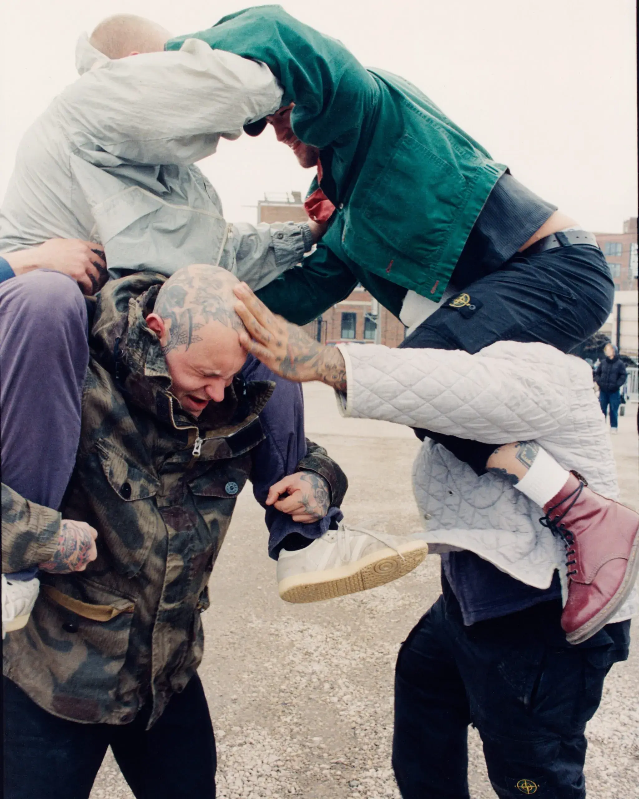 STONE ISLAND HARDCORE SUBCULTURE PROJECT image of photograph collection detailing musicians wearing vintage and modern Stone Island outerwear on tour across North America and Europe.