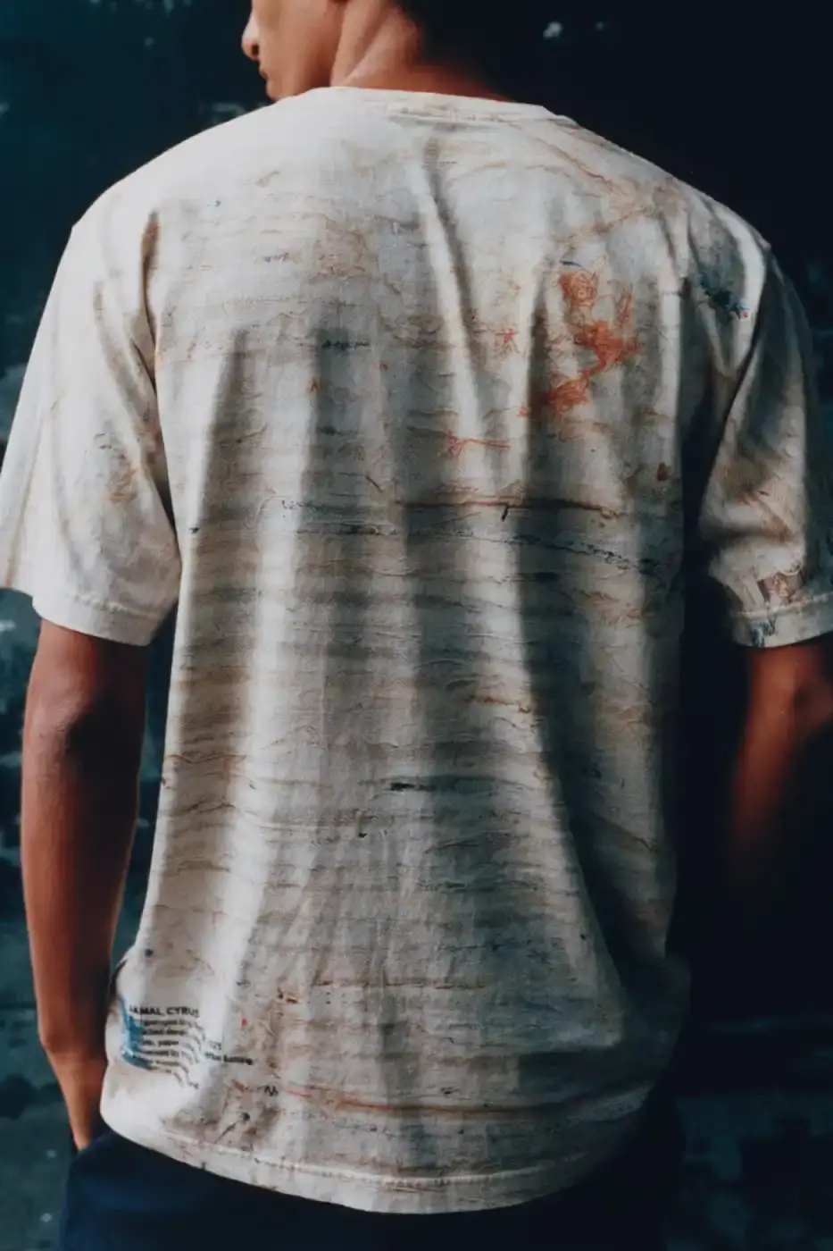 STONE ISLAND JAMAL CYRUS FRIEZE LA 2026 SHIRT A white t-shirt featuring black and grey abstract digital prints inspired by archival documents and historical collage. (image 6 of 6)
