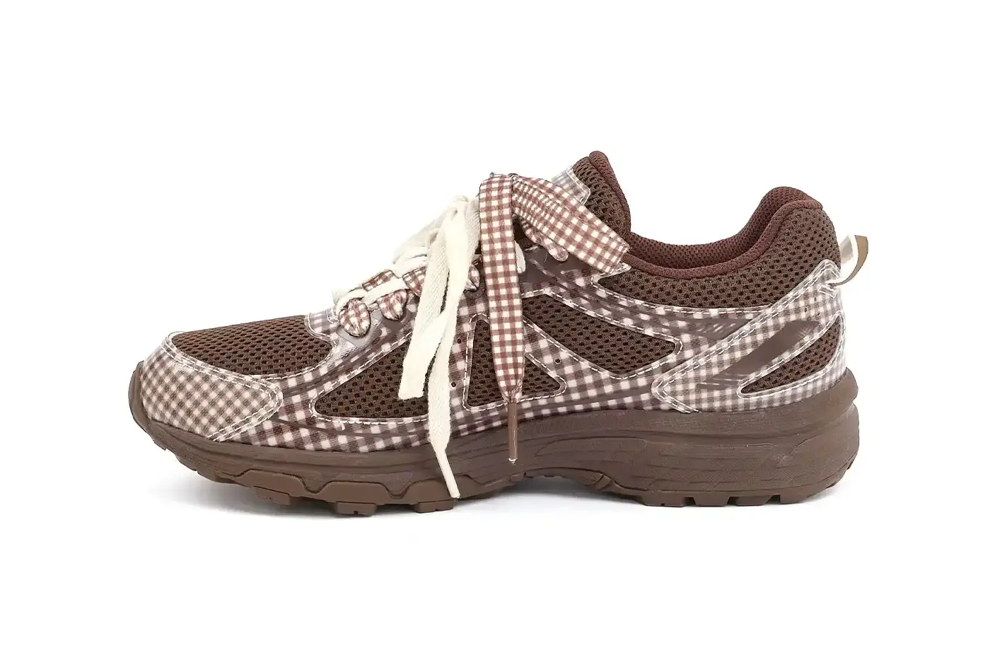 ASICS GEL-VENTURE 6 GETS GINGHAM MAKEOVER FROM STORY MFG. photo of the collaboration between sustainable fashion brand STORY mfg. and ASICS on the GEL-VENTURE 6 sneaker. It details the two gingham colorways ("Reddish Brown" and "Vanilla Violet Quartz"), the unique woven lacing system inspired by Baghdad skaters, and pricing ($133 USD). The article also describes the two-day launch event at The Truman Brewery in London on April 18-19, where visitors can contribute embroidery to a community art project while enjoying refreshments. The article provides purchase information and explains STORY mfg.'s sustainable fashion background. (image 5 of 14)