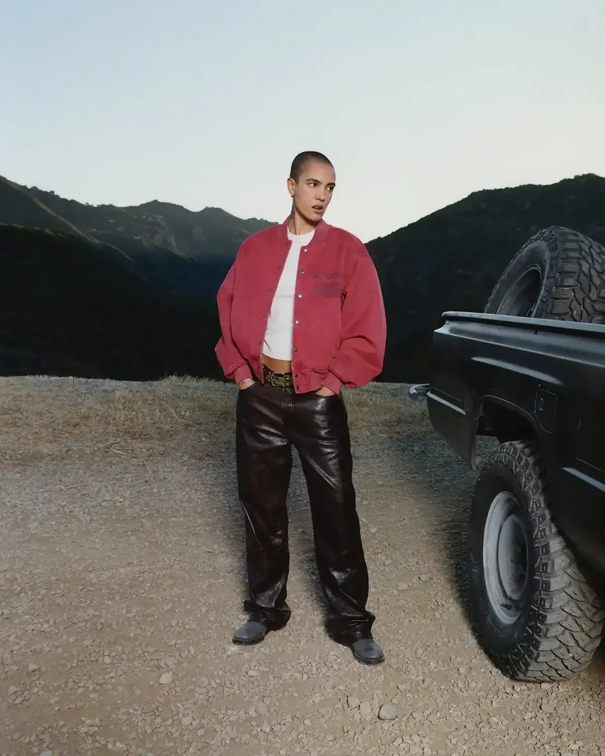 Model wearing Stüssy leather shearling coat and coordinated wool set from new collection (image 8 of 13)