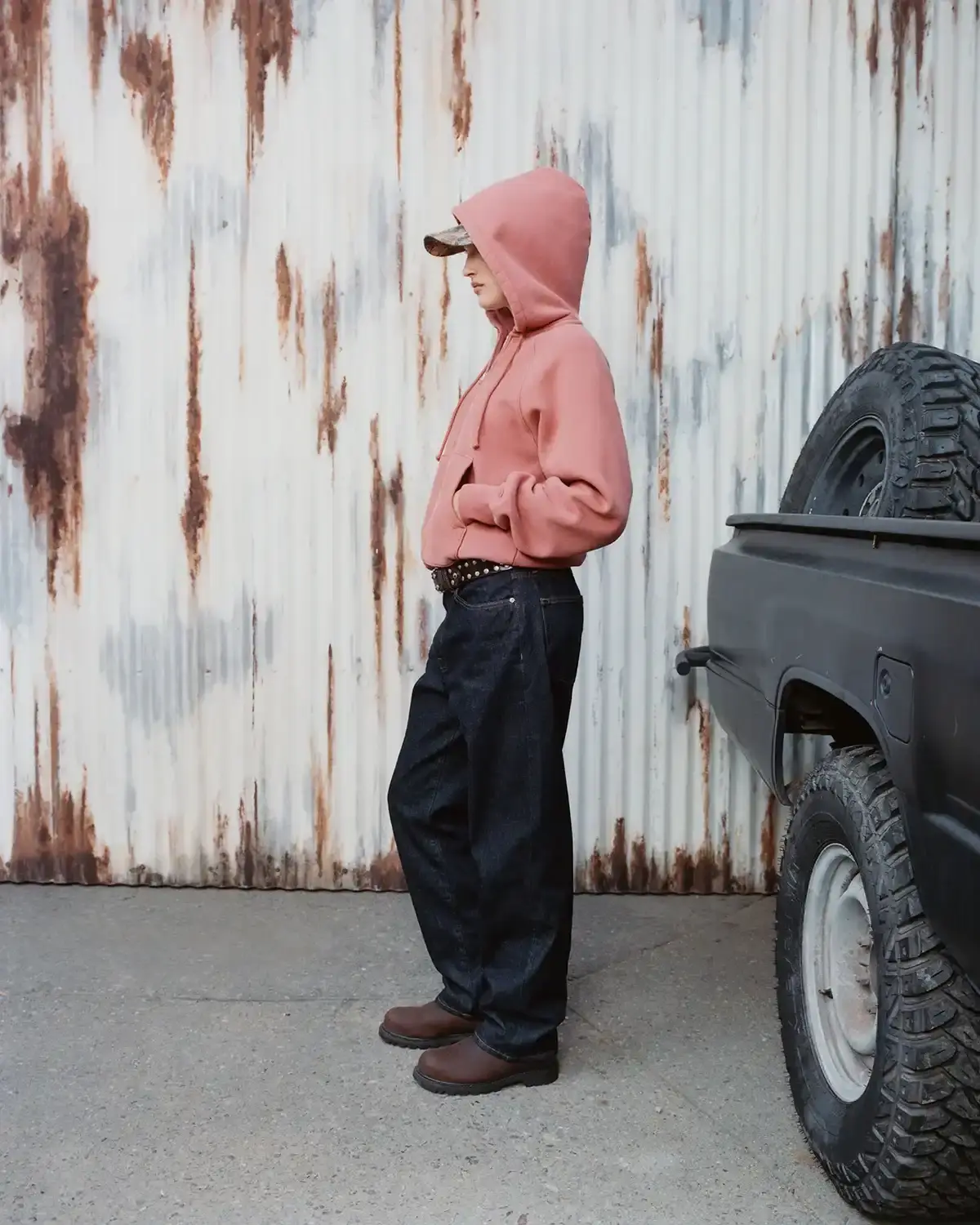 Model wearing Stüssy leather shearling coat and coordinated wool set from new collection (image 3 of 13)
