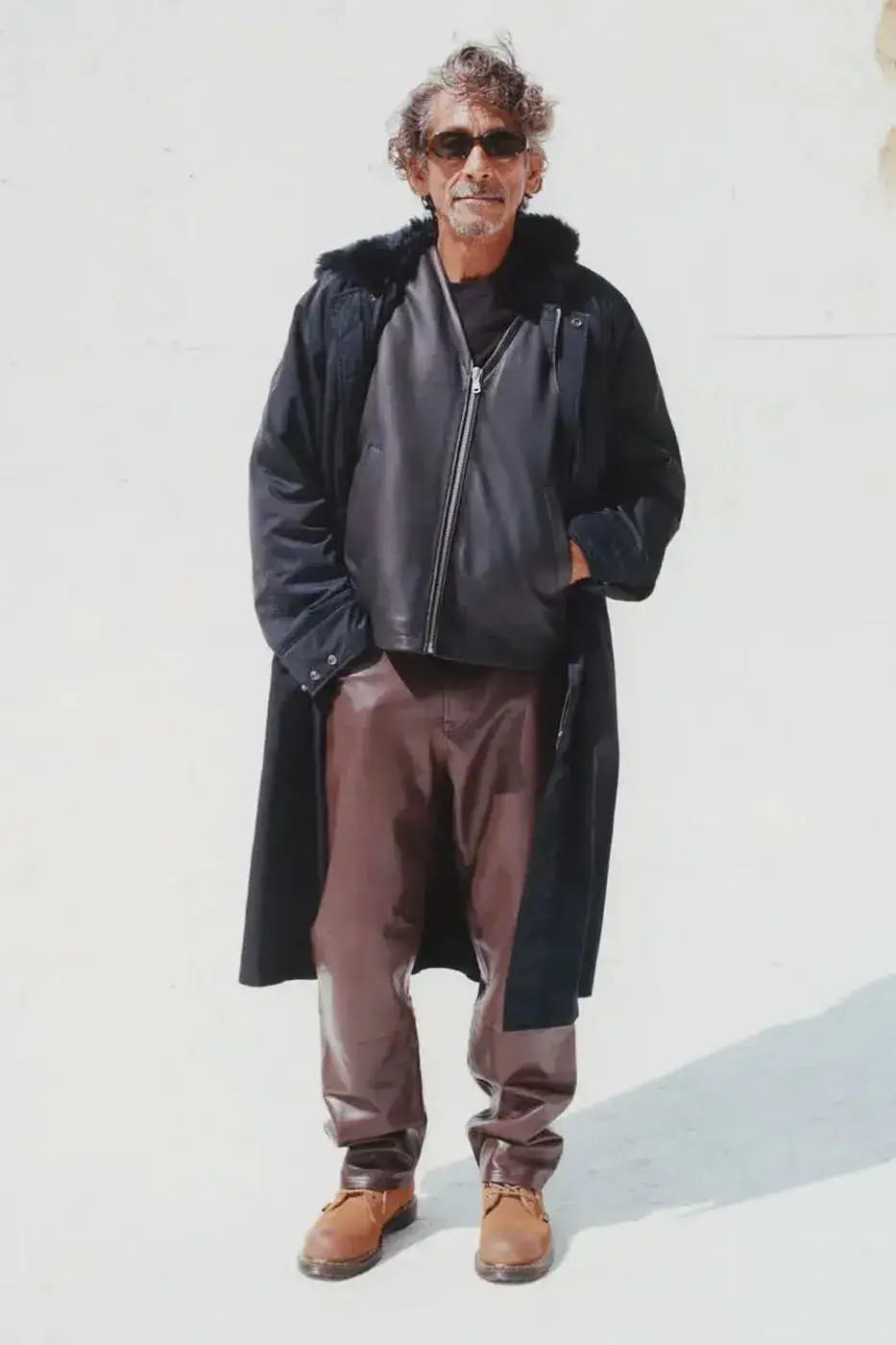 STÜSSY HOLIDAY ’26: PUFFERS, LEATHER AND CAMO PANTS image of the Stüssy Holiday ’26 collection, with outerwear and camouflage trousers, on sale October 23, 2026 at Chapter stores and online. (image 5 of 6)