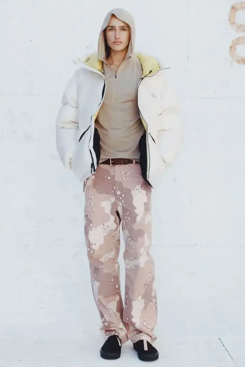 STÜSSY HOLIDAY ’26: PUFFERS, LEATHER AND CAMO PANTS image of the Stüssy Holiday ’26 collection, with outerwear and camouflage trousers, on sale October 23, 2026 at Chapter stores and online. (image 2 of 6)