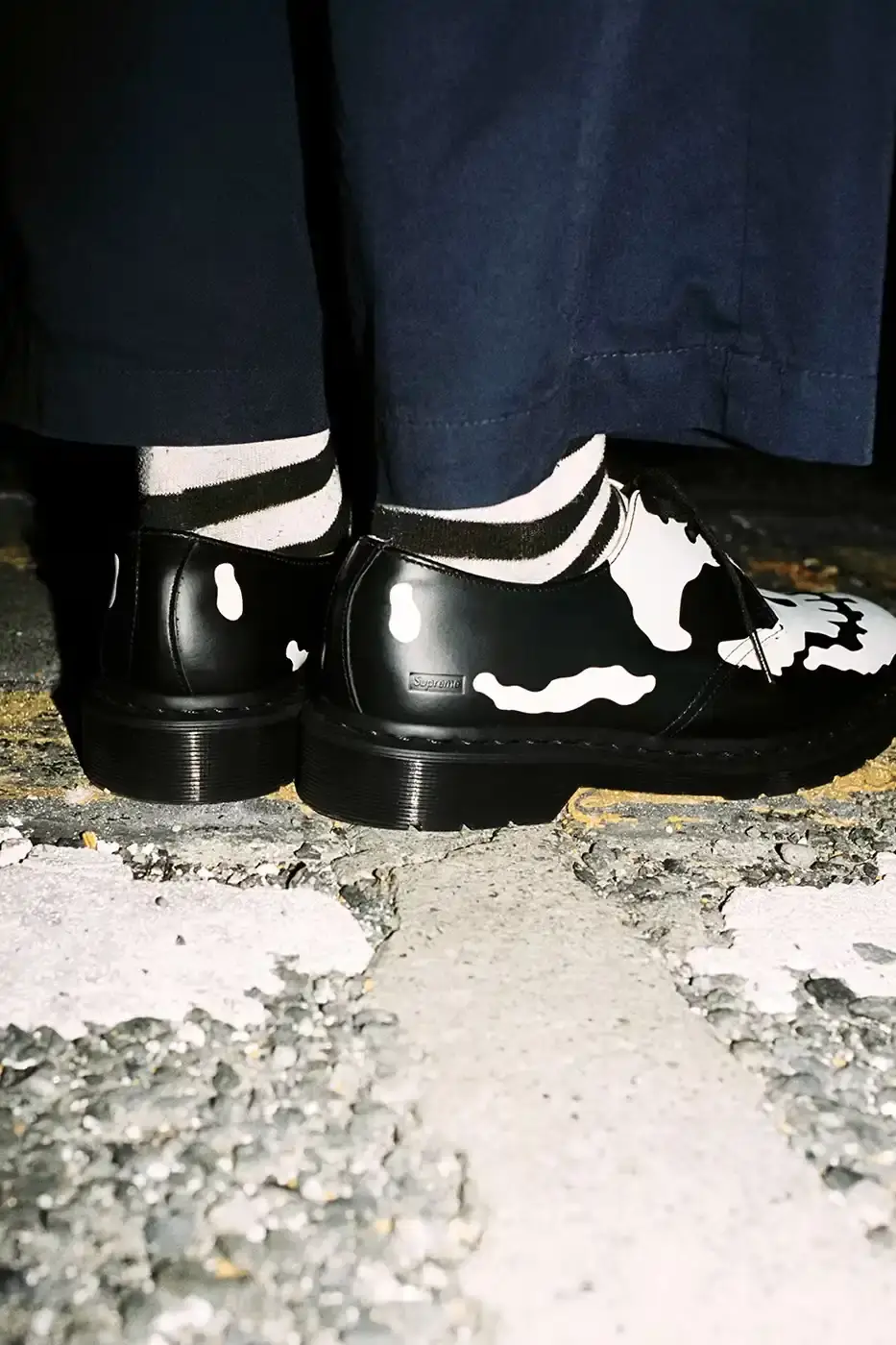 SUPREME X DR. MARTENS 1461 SHOE DROPS NOV 28 Supreme and Dr. Martens collaborate on a new 1461 3-Eye Shoe featuring printed graphics on smooth leather. The shoe releases in three colorways on November 28. (image 6 of 6)