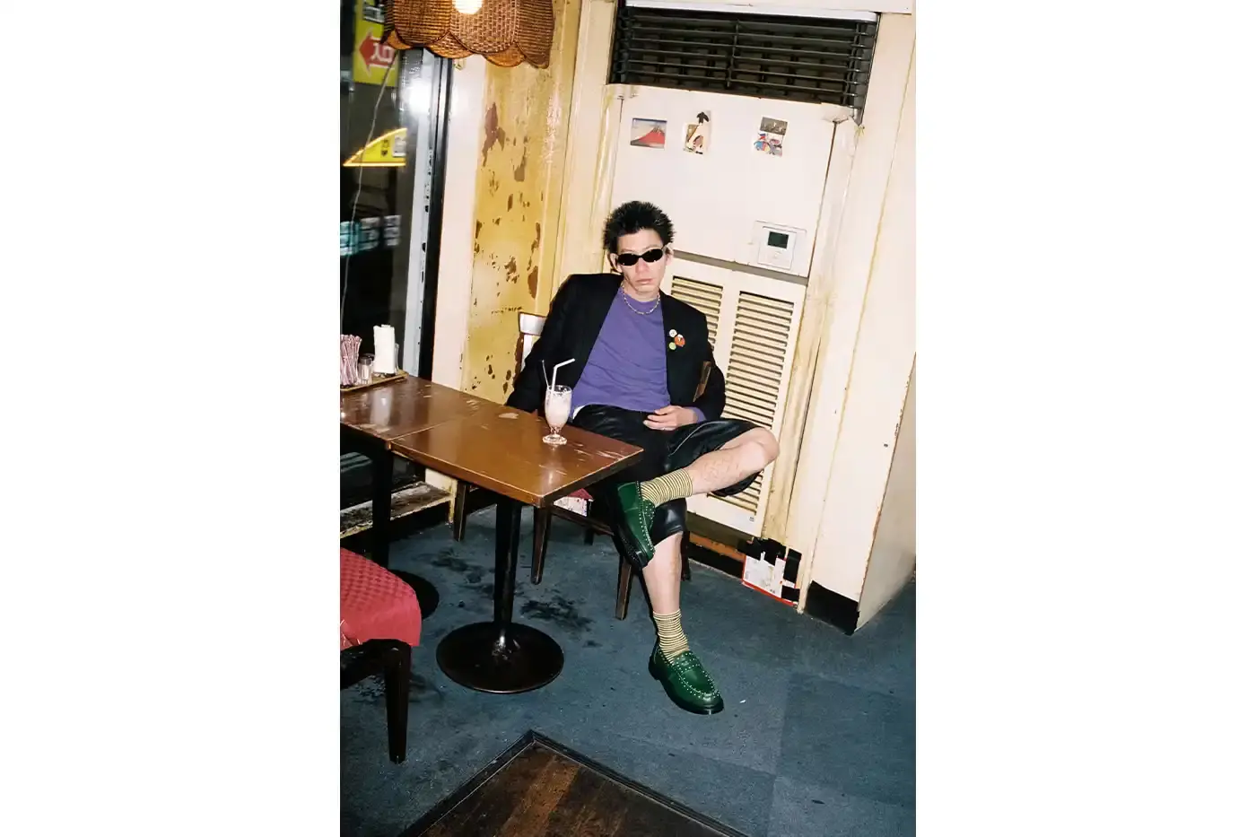 SUPREME TEAMS WITH DR. MARTENS ON EXCLUSIVE PENTON LOAFERS image of the Spring 2025 collaboration between Supreme and Dr. Martens featuring Studded Penton Loafers. The piece describes the three colorways (black, red, and green), the distinctive metal stud detailing around the shoes, co-branded footbeds, and AirWair® cushion soles. Release dates are May 22 for global markets and May 24 for Asian markets, available through Supreme's website and physical stores. The article also briefly mentions Supreme's recent footwear collaborations with Vans and Nike. (image 2 of 5)