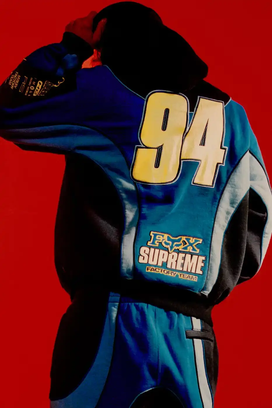 SUPREME X FOX RACING FALL 2025 DROP Supreme collaborates with Fox Racing on a Fall 2025 collection that includes motorsport gear and apparel, featuring tribute pieces to DMX with racing jerseys, helmets, and protective gear in gray camo print with red accents. (image 11 of 26)
