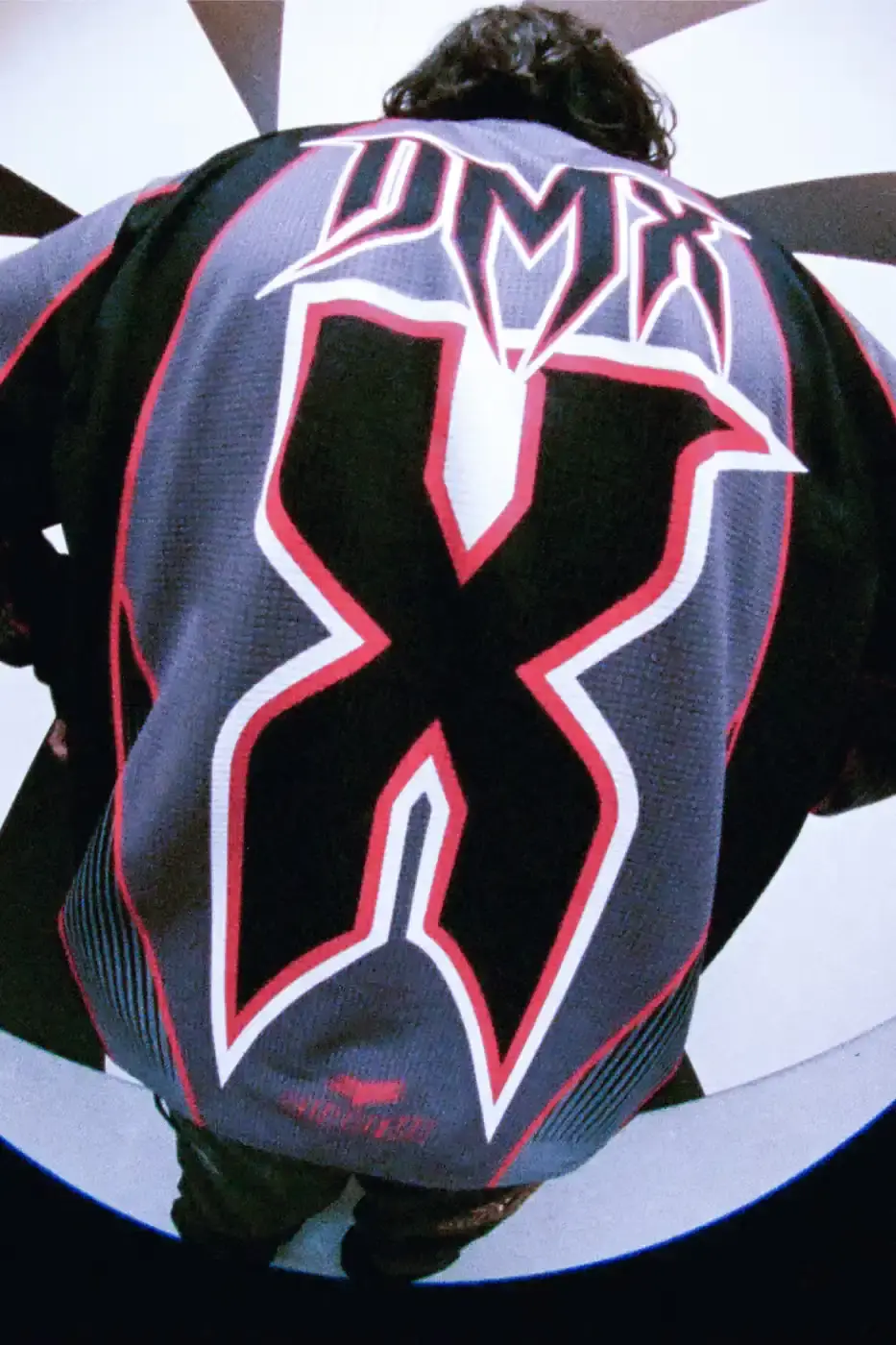 SUPREME X FOX RACING FALL 2025 DROP Supreme collaborates with Fox Racing on a Fall 2025 collection that includes motorsport gear and apparel, featuring tribute pieces to DMX with racing jerseys, helmets, and protective gear in gray camo print with red accents. (image 19 of 26)