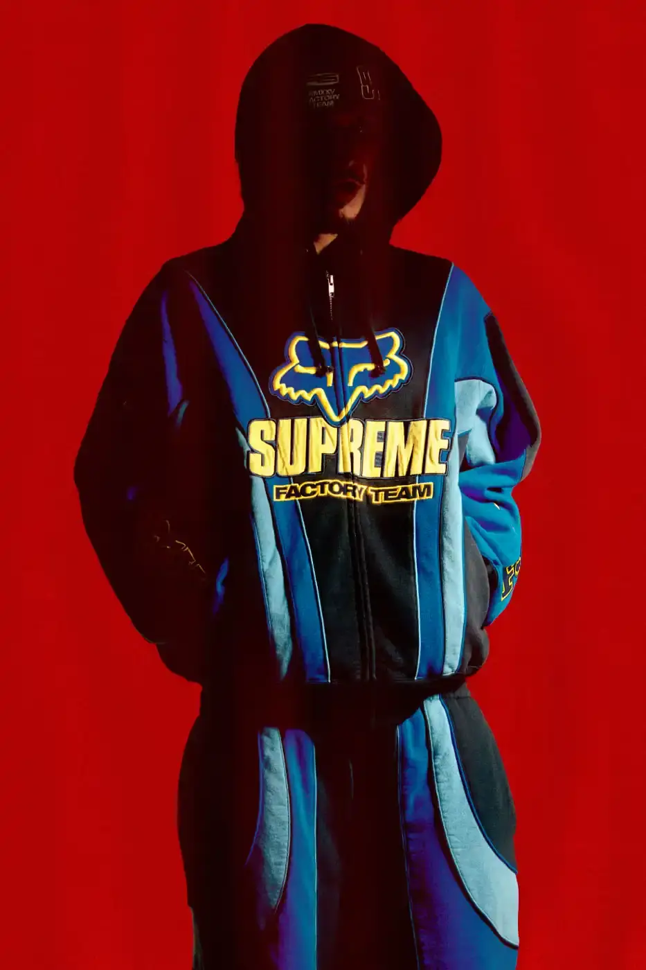SUPREME X FOX RACING FALL 2025 DROP Supreme collaborates with Fox Racing on a Fall 2025 collection that includes motorsport gear and apparel, featuring tribute pieces to DMX with racing jerseys, helmets, and protective gear in gray camo print with red accents. (image 12 of 26)