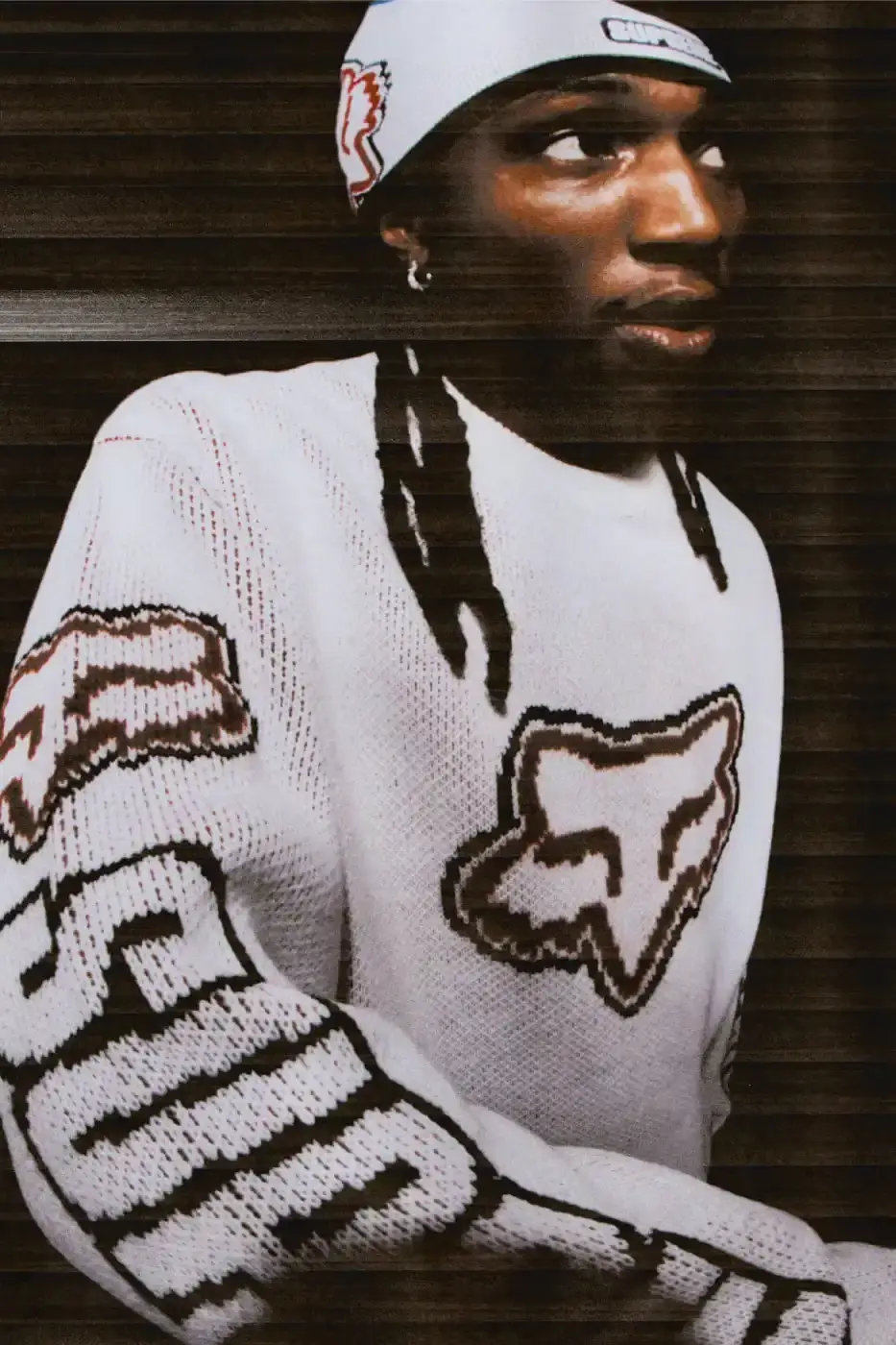 SUPREME X FOX RACING FALL 2025 DROP Supreme collaborates with Fox Racing on a Fall 2025 collection that includes motorsport gear and apparel, featuring tribute pieces to DMX with racing jerseys, helmets, and protective gear in gray camo print with red accents. (image 7 of 26)