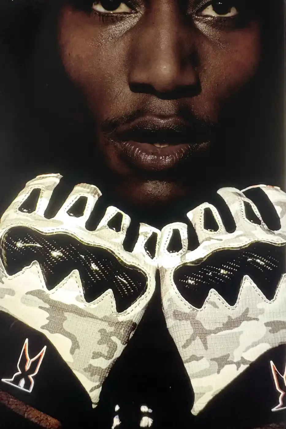 SUPREME X FOX RACING FALL 2025 DROP Supreme collaborates with Fox Racing on a Fall 2025 collection that includes motorsport gear and apparel, featuring tribute pieces to DMX with racing jerseys, helmets, and protective gear in gray camo print with red accents. (image 5 of 26)