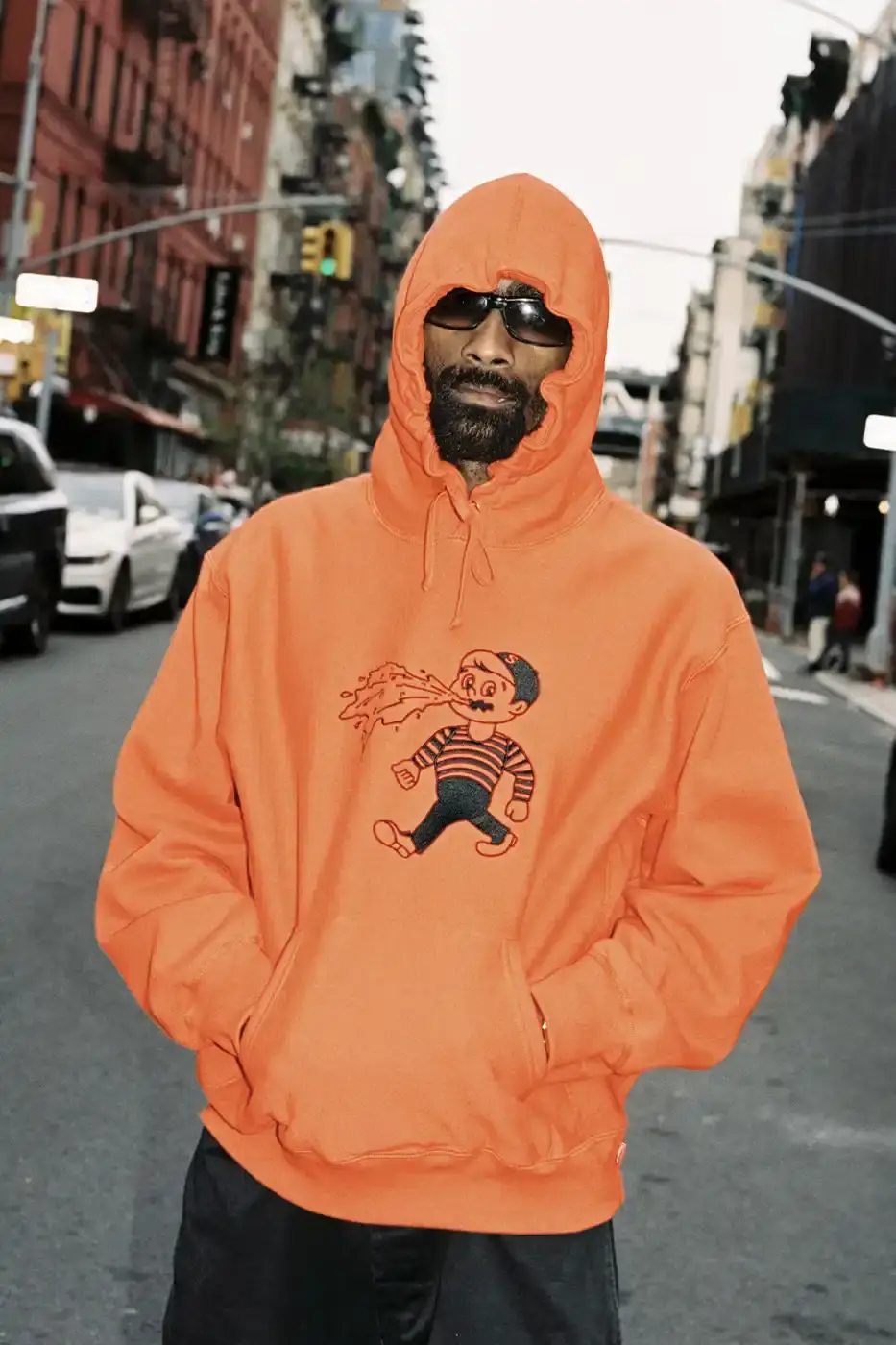 SUPREME PARTNERS WITH HOMERUN FOR BASEBALL-INSPIRED COLLECTION image of the Spring 2025 collaboration between Supreme and Homerun, a brand based in both New York City and Tokyo. The collection features baseball-inspired apparel including varsity jackets in silver and black, baseball jerseys in teal, navy, and pinstriped designs, plus hooded sweatshirts, t-shirts, and New Era caps. All items display co-branding with Homerun's cartoon graphics and "Non Stop" motto. The collection launches May 15 globally and May 17 in Asia through Supreme's website and stores. (image 5 of 14)