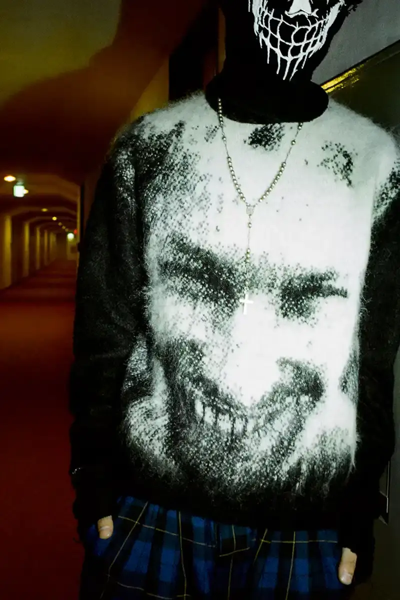 Supreme Supreme x Aphex Twin capsule collection lookbook image showing clothing items featuring iconic Aphex Twin album artwork and logos, including the distinctive logo designed by Paul Nicholson. (image 4 of 10)