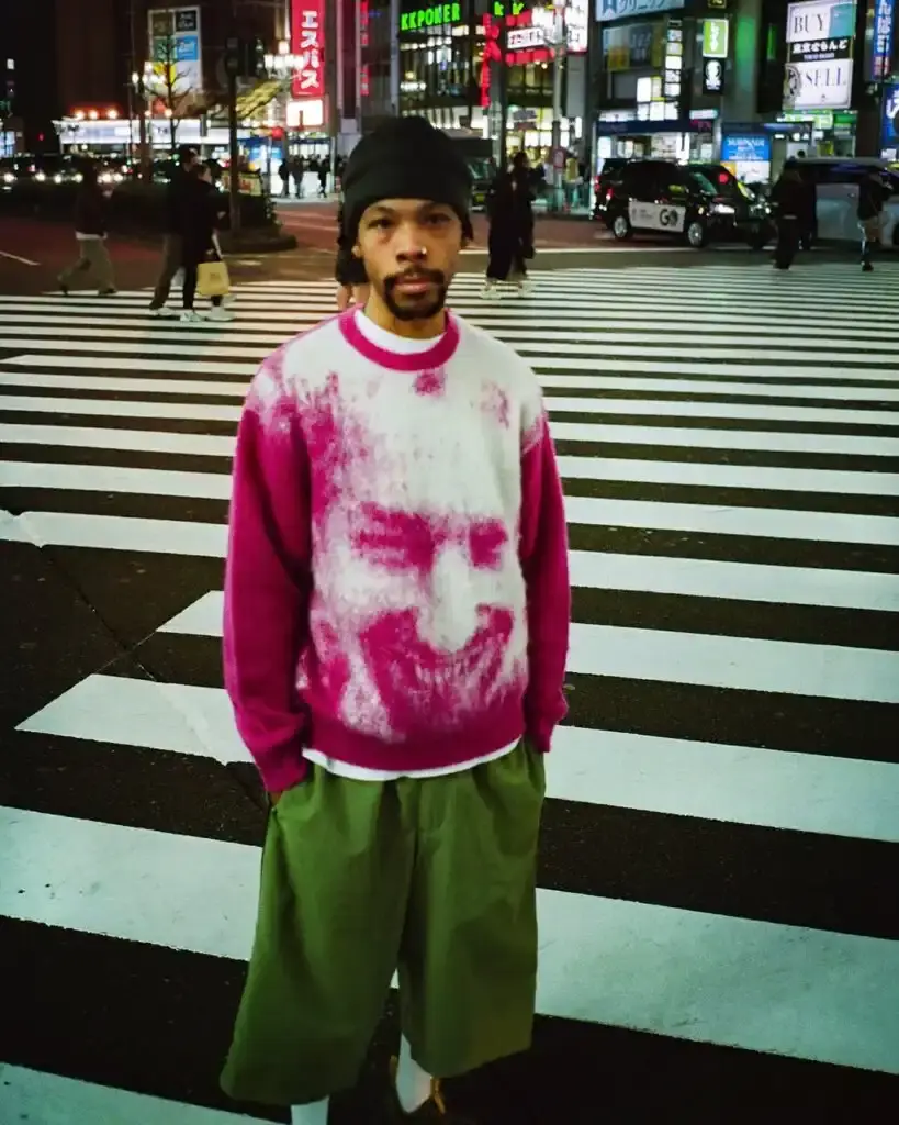 Supreme Supreme x Aphex Twin capsule collection lookbook image showing clothing items featuring iconic Aphex Twin album artwork and logos, including the distinctive logo designed by Paul Nicholson. (image 8 of 10)