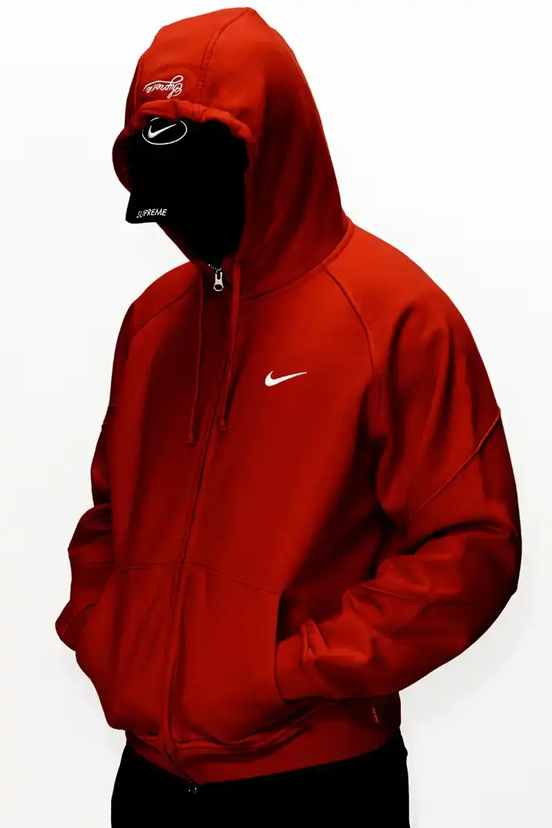 Supreme/Nike Supreme x Nike Spring 2025 Collection featuring black and white Leather Varsity Jackets, purple, yellow and black Track Suits, striped Rugby shirts, Sweater Vests, Hooded Sweatshirts, and accessories including Running Hats and Leather Shoulder Bags. (image 4 of 22)