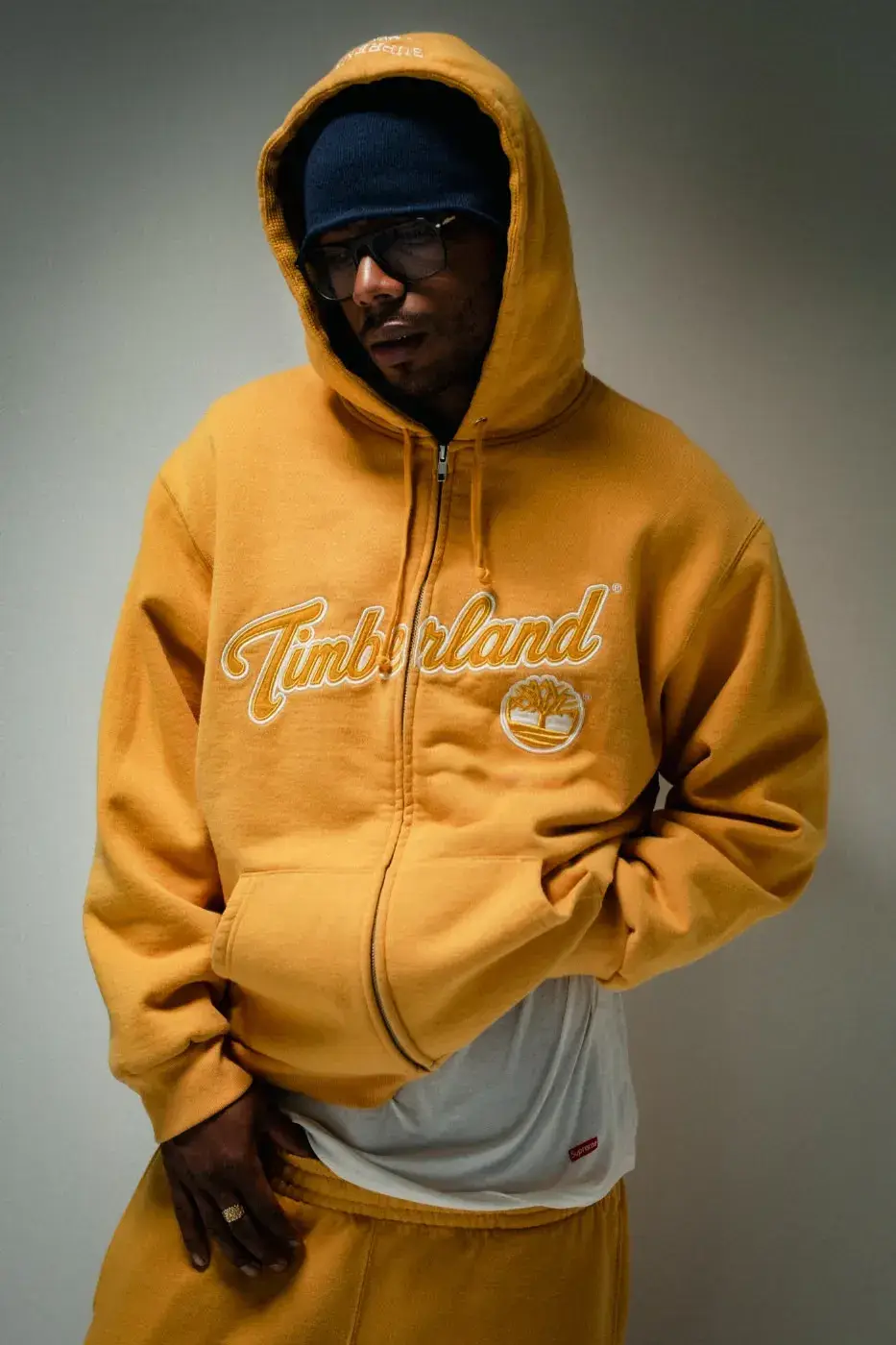 SUPREME X TIMBERLAND FALL 2026 APPAREL DROPS OCTOBER 22 Text summary of an article about the Supreme and Timberland Fall 2026 collection, which includes jackets, tops, pants and headwear and releases on October 22 and October 24. (image 13 of 19)