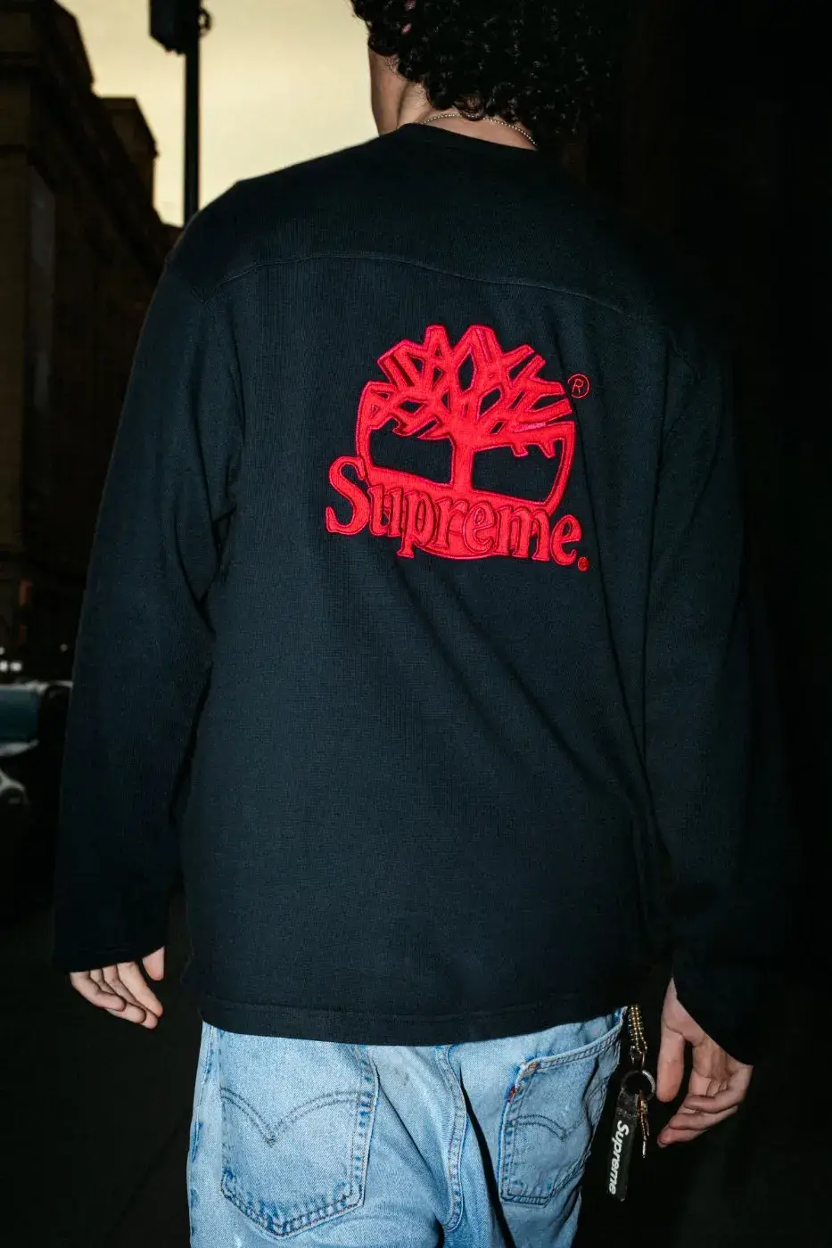 SUPREME X TIMBERLAND FALL 2026 APPAREL DROPS OCTOBER 22 Text summary of an article about the Supreme and Timberland Fall 2026 collection, which includes jackets, tops, pants and headwear and releases on October 22 and October 24. (image 18 of 19)