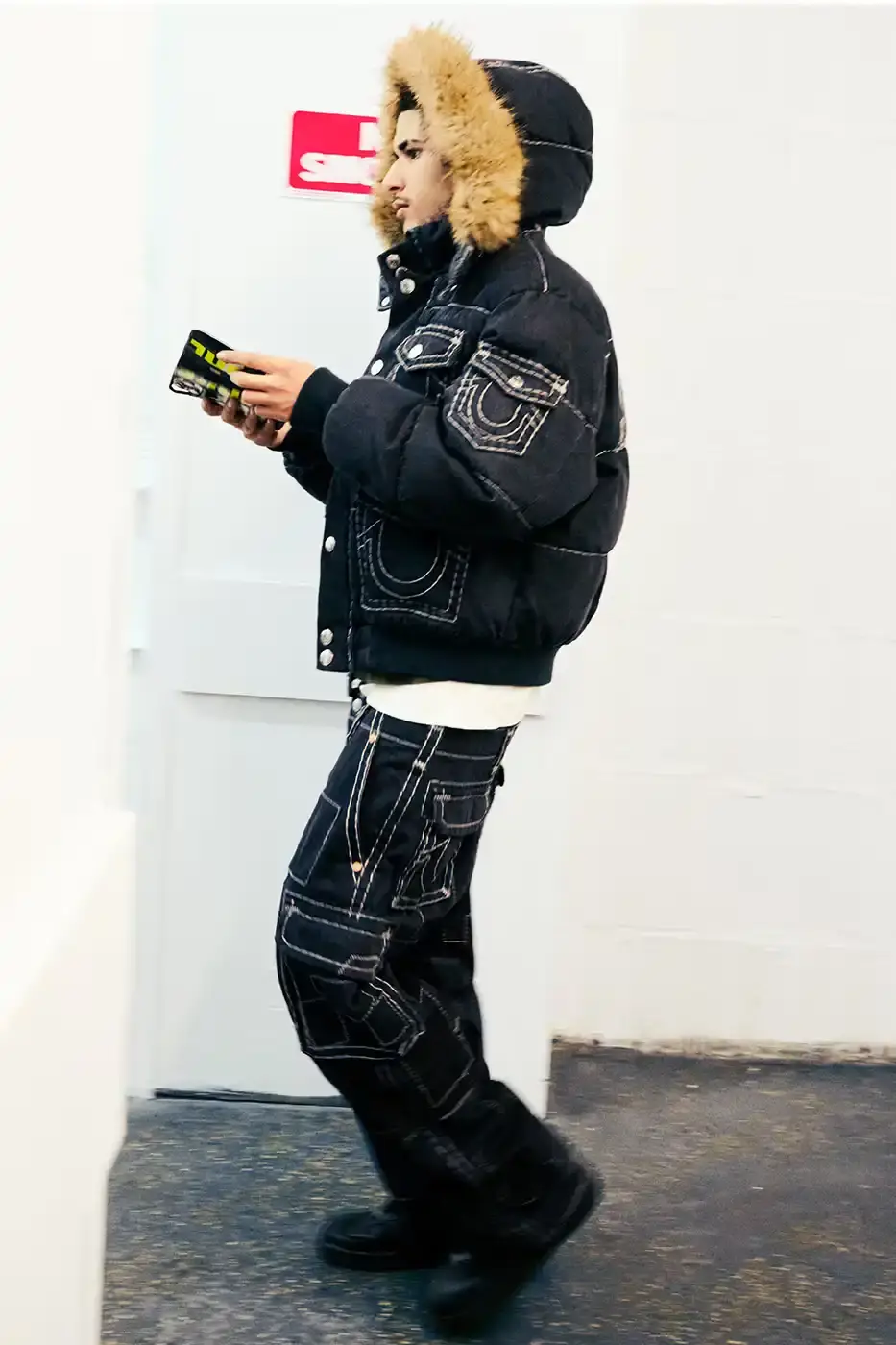 SUPREME TEAMS WITH TRUE RELIGION FOR FALL 2025 Supreme and True Religion announce a Fall 2025 collaboration featuring denim and leather outerwear, hoodies, accessories, and signature horseshoe logo details, releasing November 20, 2025. (image 3 of 15)
