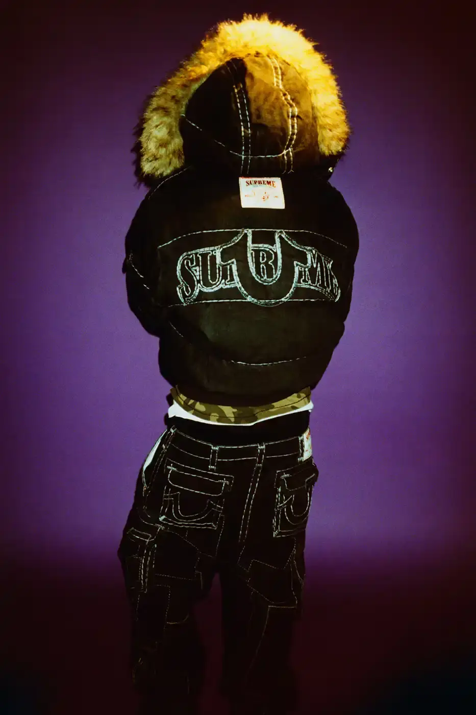 SUPREME TEAMS WITH TRUE RELIGION FOR FALL 2025 Supreme and True Religion announce a Fall 2025 collaboration featuring denim and leather outerwear, hoodies, accessories, and signature horseshoe logo details, releasing November 20, 2025. (image 2 of 15)