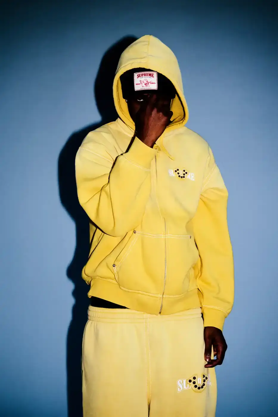 SUPREME TEAMS WITH TRUE RELIGION FOR FALL 2025 Supreme and True Religion announce a Fall 2025 collaboration featuring denim and leather outerwear, hoodies, accessories, and signature horseshoe logo details, releasing November 20, 2025. (image 8 of 15)