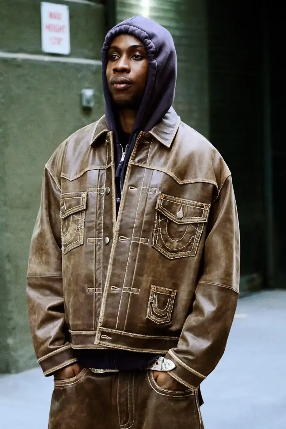 SUPREME TEAMS WITH TRUE RELIGION FOR FALL 2025 Supreme and True Religion announce a Fall 2025 collaboration featuring denim and leather outerwear, hoodies, accessories, and signature horseshoe logo details, releasing November 20, 2025. (image 13 of 15)