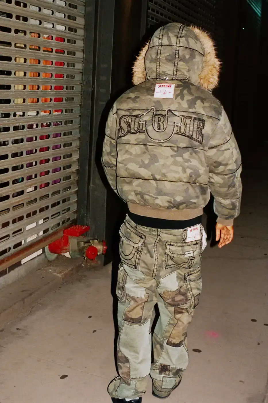 SUPREME TEAMS WITH TRUE RELIGION FOR FALL 2025 Supreme and True Religion announce a Fall 2025 collaboration featuring denim and leather outerwear, hoodies, accessories, and signature horseshoe logo details, releasing November 20, 2025. (image 5 of 15)