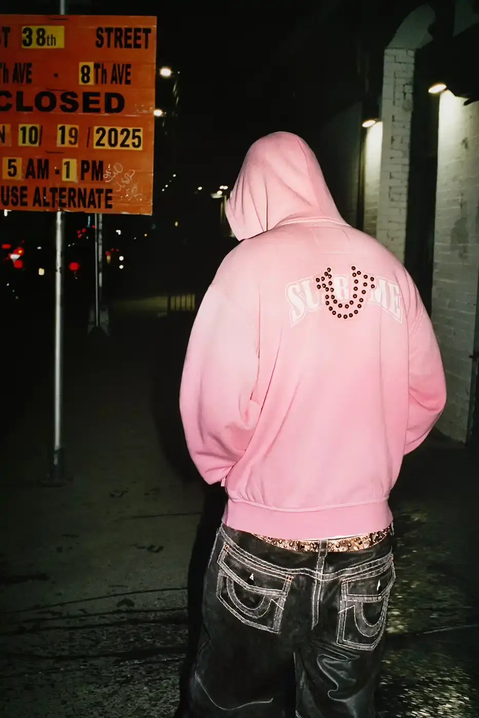 SUPREME TEAMS WITH TRUE RELIGION FOR FALL 2025 Supreme and True Religion announce a Fall 2025 collaboration featuring denim and leather outerwear, hoodies, accessories, and signature horseshoe logo details, releasing November 20, 2025. (image 6 of 15)