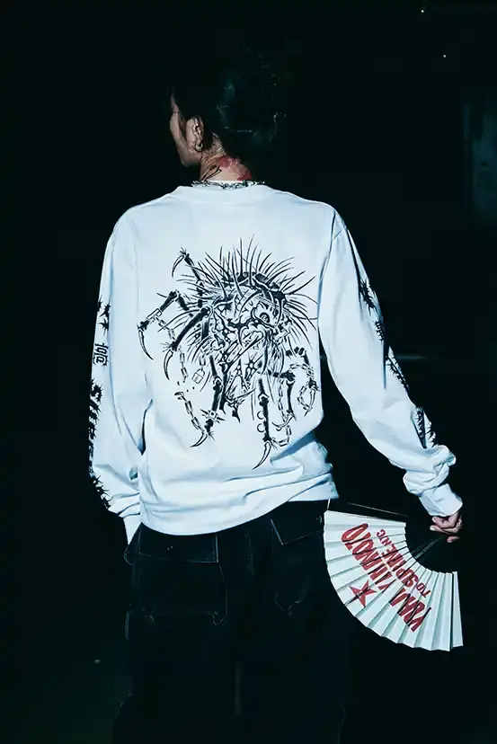 SUPREME X Y'S YAMAMOTO FALL 2025 COLLECTION Fashion collaboration image describing Supreme and Y's by Yohji Yamamoto Fall 2025 collection featuring punk aesthetics and skull designs. (image 3 of 20)