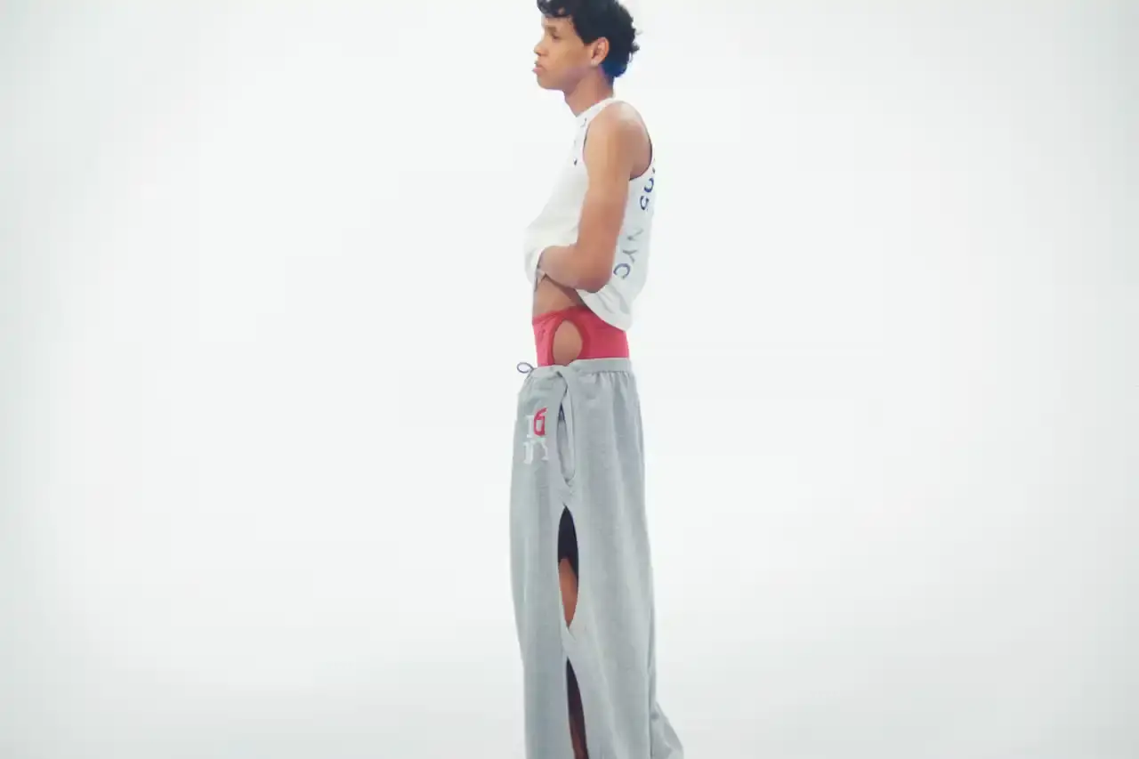 TELFAR LAUNCHES EXPANSIVE DENIM COLLECTION IN SOHO Telfar's new Infinity Collection, highlighting the brand's innovative approach to denim design. The collection features versatile, unisex garments with transformative silhouettes, priced between $190-$485. Key points include multipurpose clothing, unique cut-out designs, and an unconventional retail strategy at the Soho flagship store. The text provides detailed information about the collection's aesthetic, pricing, and availability for readers using screen readers or assistive technologies. (image 13 of 20)