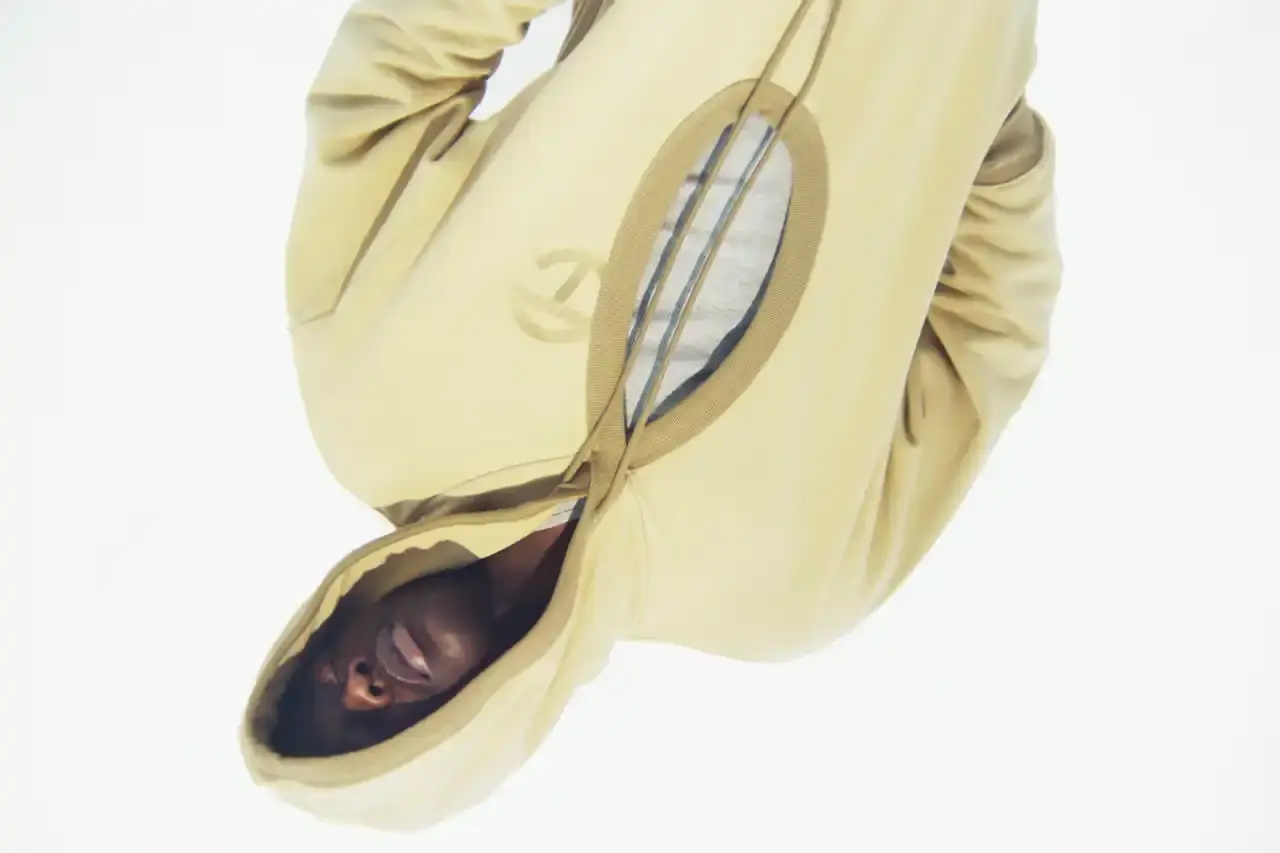 TELFAR LAUNCHES EXPANSIVE DENIM COLLECTION IN SOHO Telfar's new Infinity Collection, highlighting the brand's innovative approach to denim design. The collection features versatile, unisex garments with transformative silhouettes, priced between $190-$485. Key points include multipurpose clothing, unique cut-out designs, and an unconventional retail strategy at the Soho flagship store. The text provides detailed information about the collection's aesthetic, pricing, and availability for readers using screen readers or assistive technologies. (image 15 of 20)