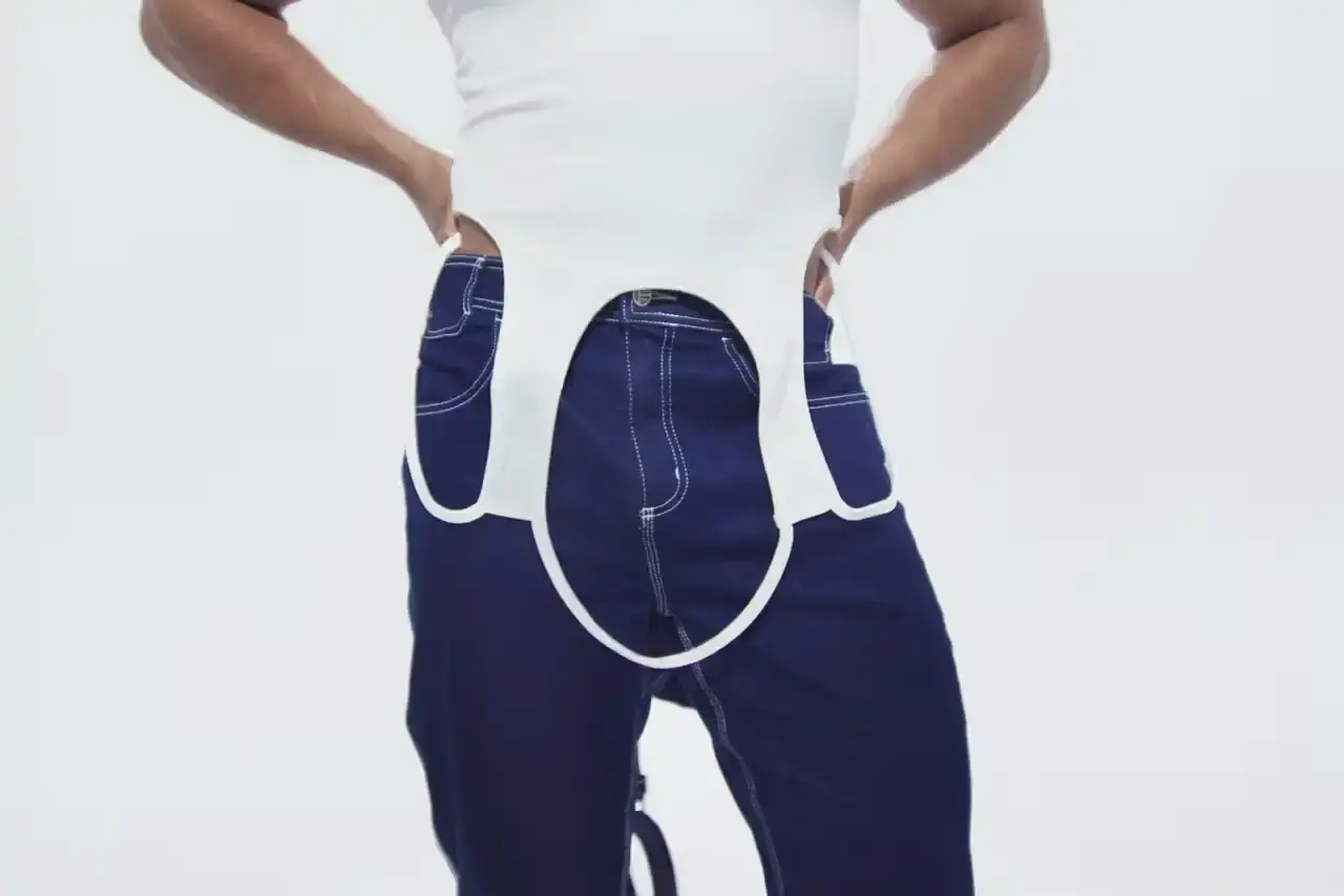 TELFAR LAUNCHES EXPANSIVE DENIM COLLECTION IN SOHO Telfar's new Infinity Collection, highlighting the brand's innovative approach to denim design. The collection features versatile, unisex garments with transformative silhouettes, priced between $190-$485. Key points include multipurpose clothing, unique cut-out designs, and an unconventional retail strategy at the Soho flagship store. The text provides detailed information about the collection's aesthetic, pricing, and availability for readers using screen readers or assistive technologies. (image 18 of 20)