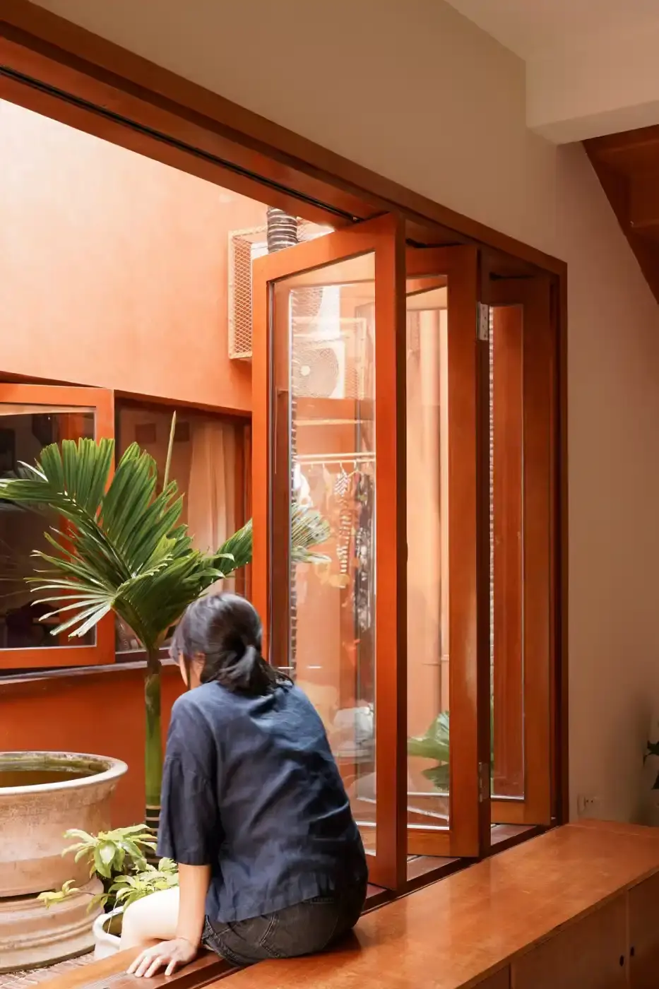 TERRACOTTA BRICK HOUSE IN VIETNAM BALANCES VENTILATION & PRIVACY Live Out Studio, A residential house in Da Nang, Vietnam features perforated terracotta brick walls and internal courtyards to provide ventilation and natural light in a narrow urban lot. (image 7 of 12)