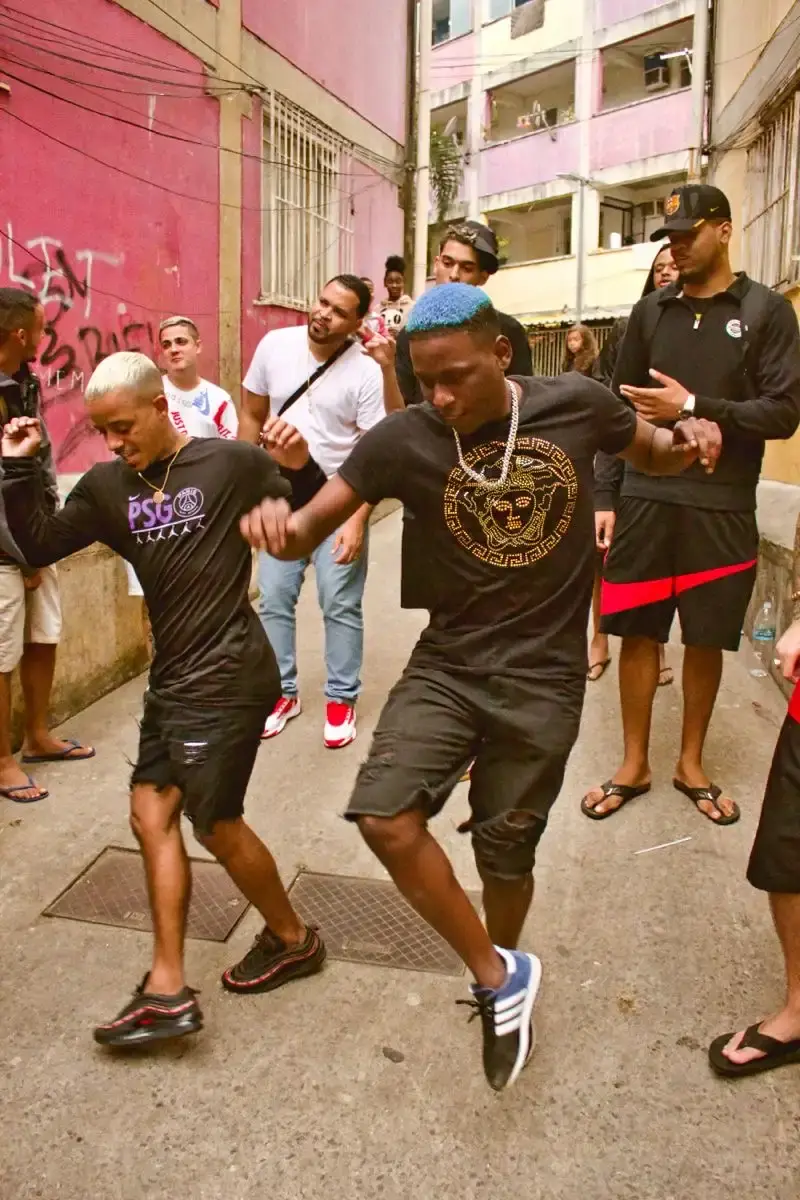 image depicting Baile Funk artists, Brazilian street scenes, music festival performance, and vibrant dance choreography representing the genre's cultural evolution and global impact. (image 2 of 3)