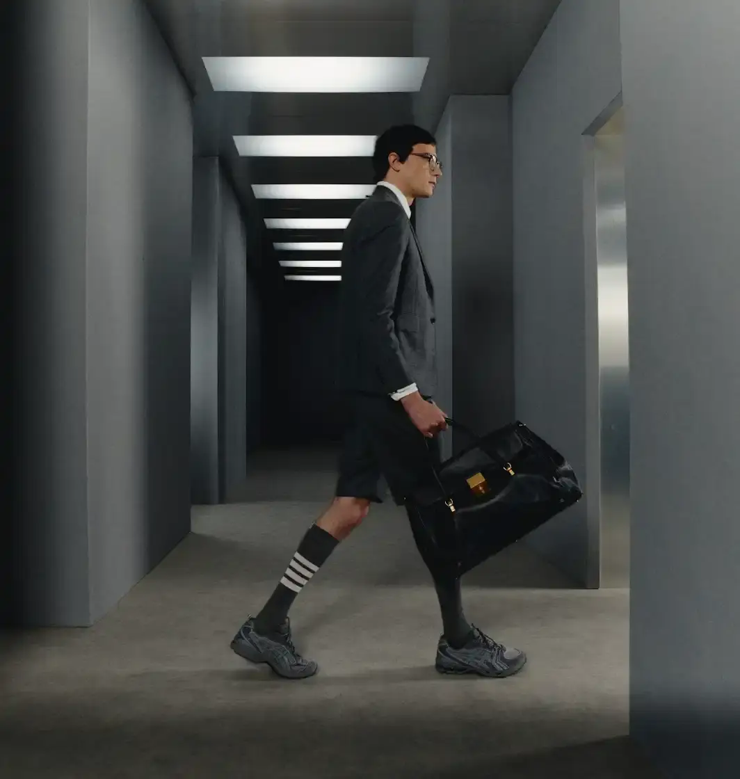 THOM BROWNE AND ASICS REWORK THE GEL-KAYANO 14 image describing the Thom Browne x ASICS GEL-KAYANO 14 collaboration, covering design details, materials, availability, and background on both brands. (image 6 of 6)