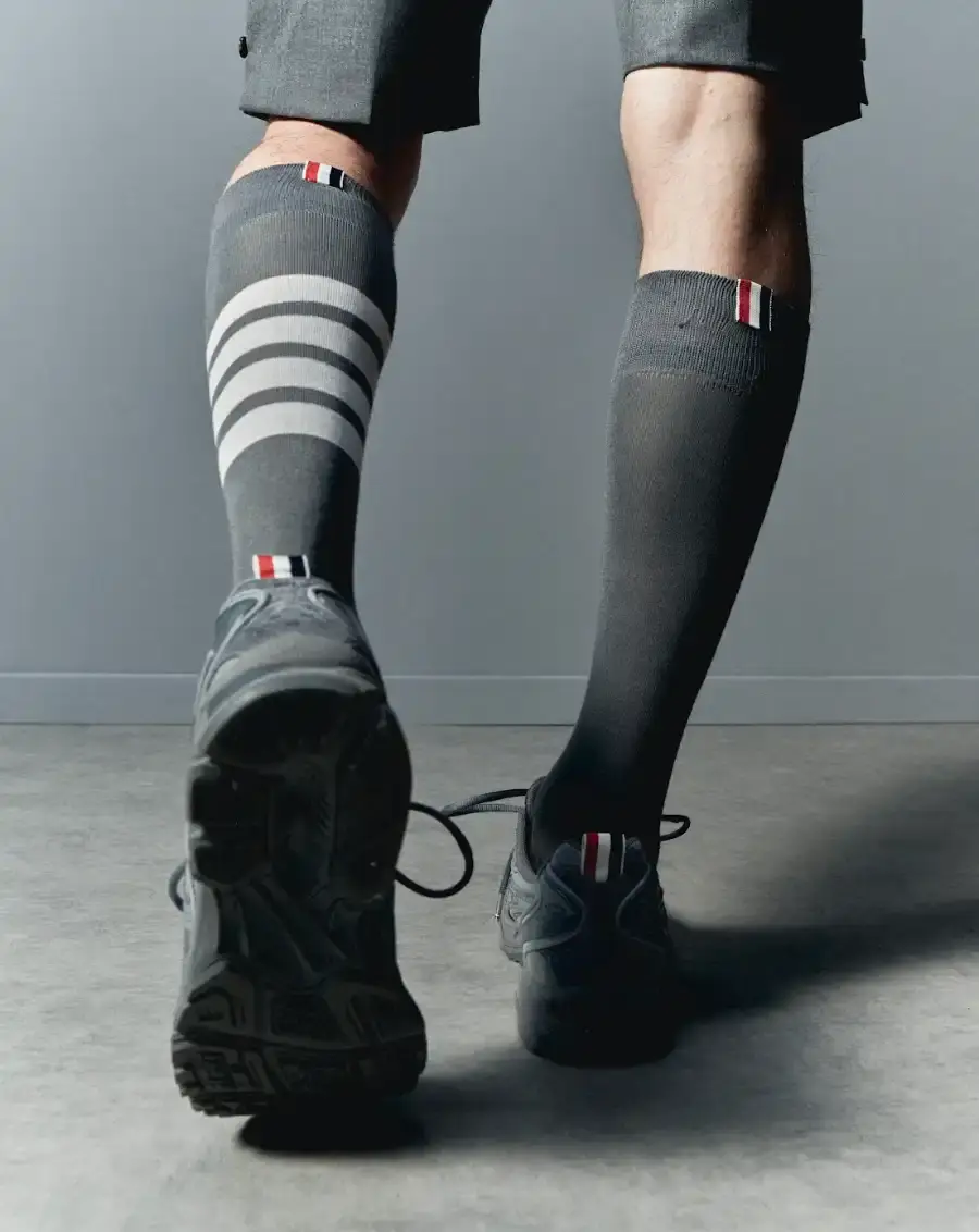 THOM BROWNE AND ASICS REWORK THE GEL-KAYANO 14 image describing the Thom Browne x ASICS GEL-KAYANO 14 collaboration, covering design details, materials, availability, and background on both brands. (image 3 of 6)