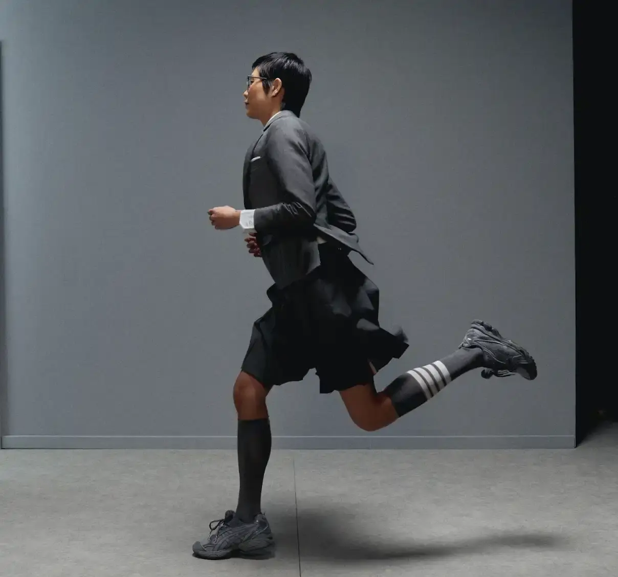 THOM BROWNE AND ASICS REWORK THE GEL-KAYANO 14 image describing the Thom Browne x ASICS GEL-KAYANO 14 collaboration, covering design details, materials, availability, and background on both brands. (image 4 of 6)