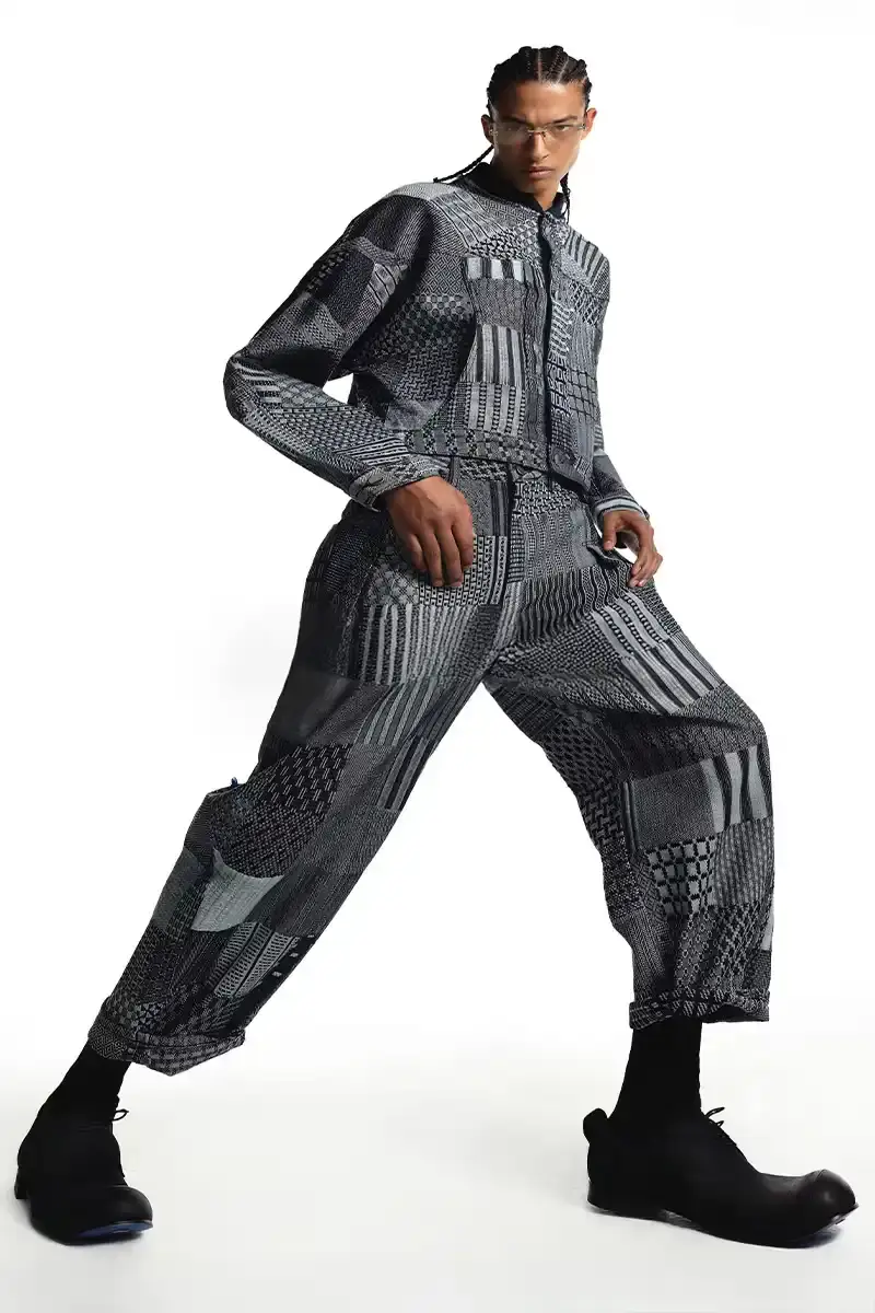 ADER ERROR A fashion collection lookbook featuring minimalist designs that blend architectural silhouettes with subtle, intricate details. Garments in muted tones showcase complex knot work, layered textures, and geometric patterns that explore themes of memory and connection. Models wear carefully constructed outerwear, skirt sets, and tops that challenge traditional fashion boundaries. (image 3 of 3)